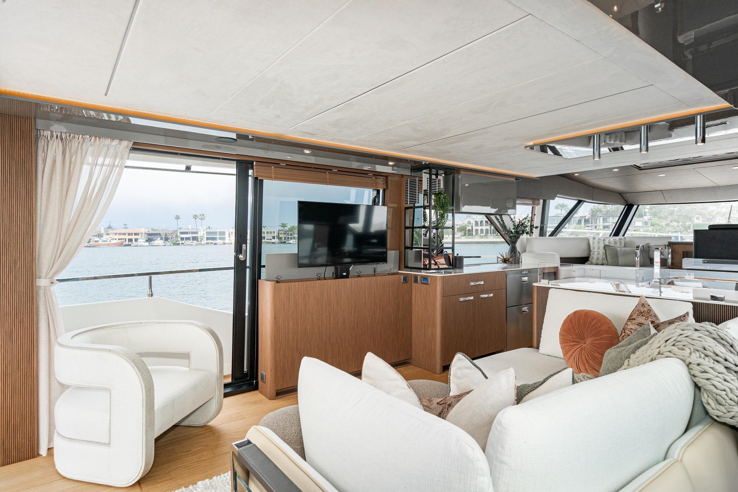 Luxurious interior of 2024 Prestige X60 yacht with modern furnishings and panoramic windows.