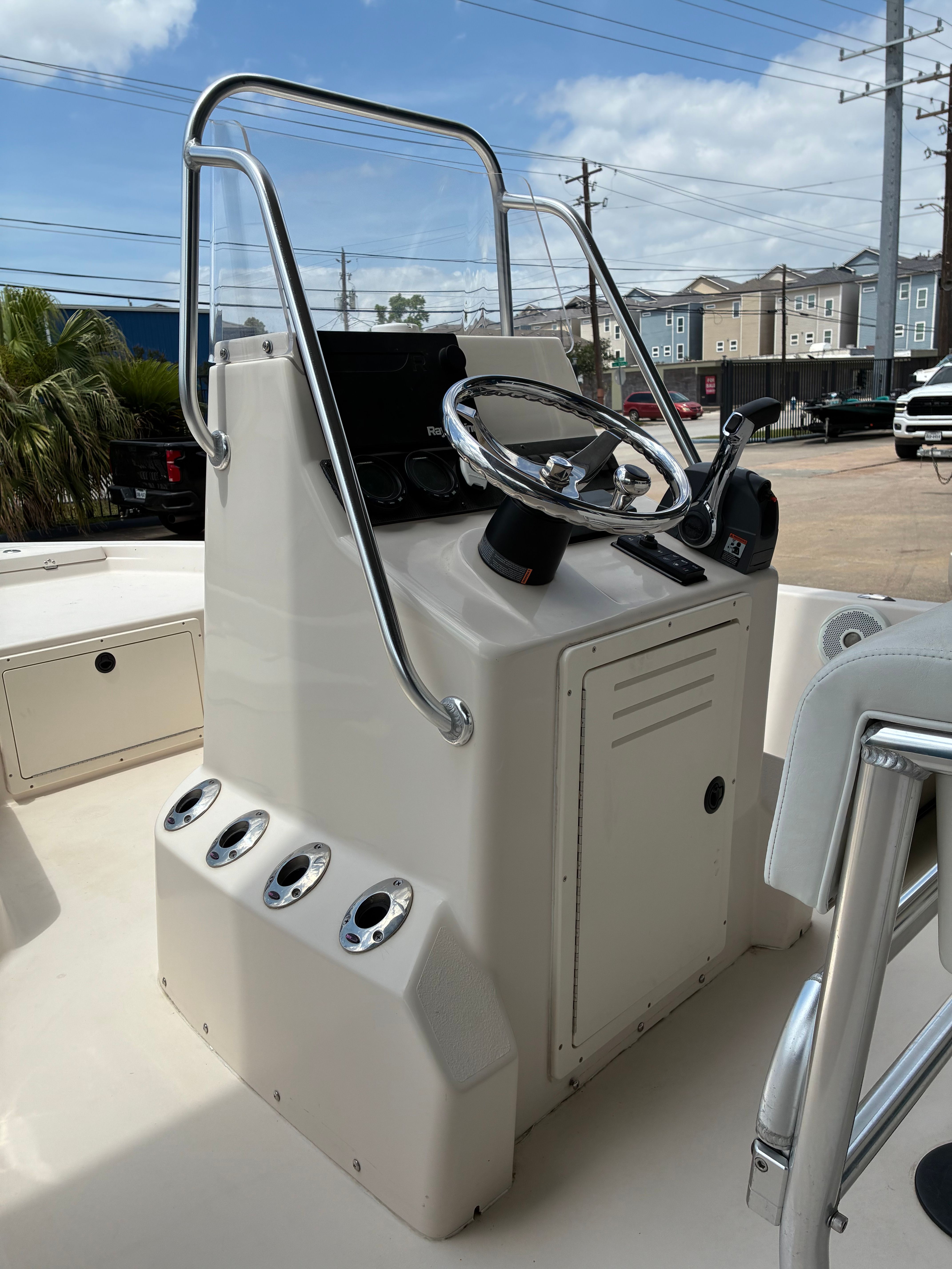 2016 Pathfinder Fishing boat console with steering wheel and controls.