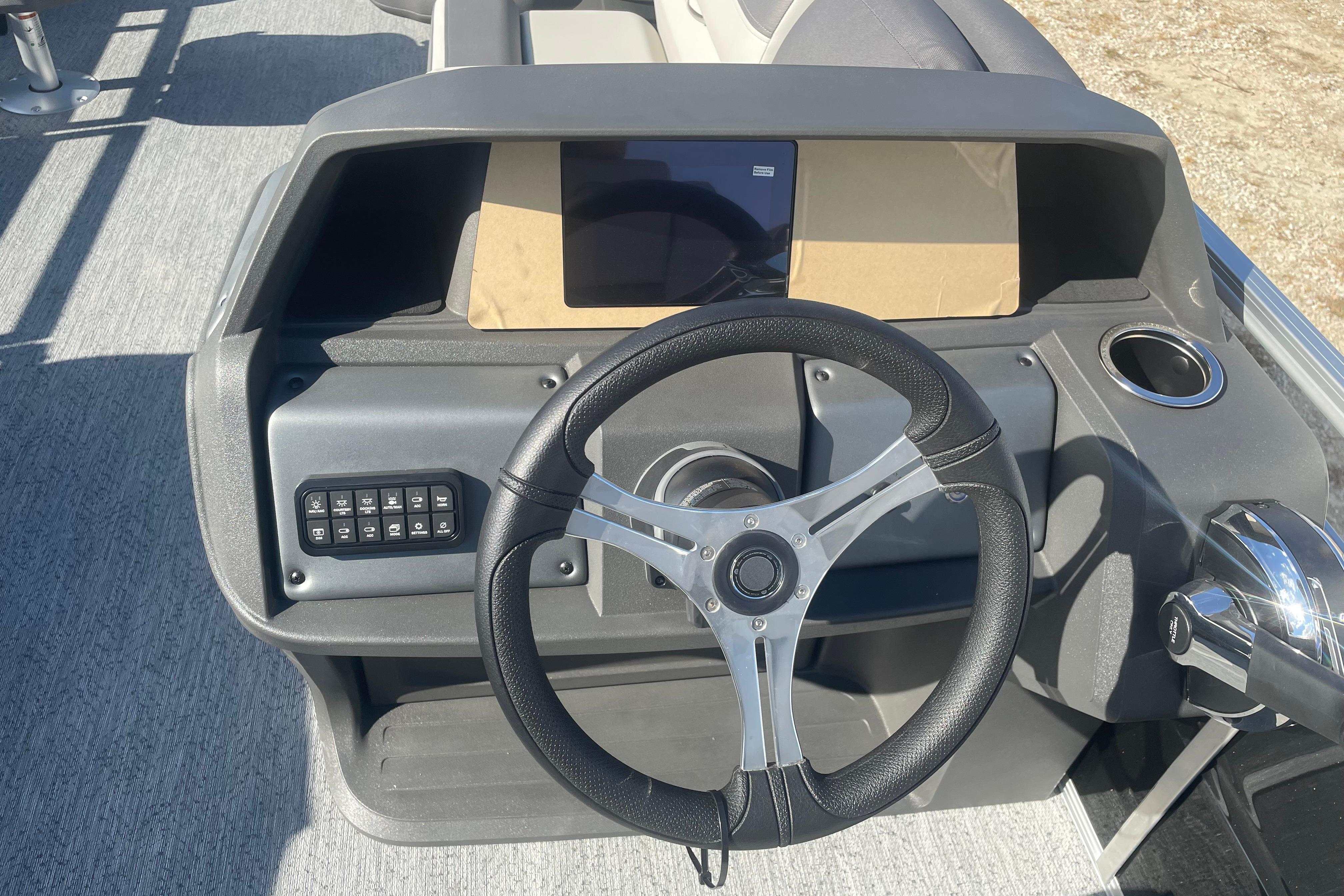 Steering console of 2026 Sun Tracker Fishin' Barge 20 DLX pontoon boat.