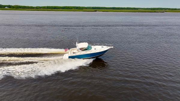 1996 Tiara Yachts 3500 Express cruising swiftly on the water.