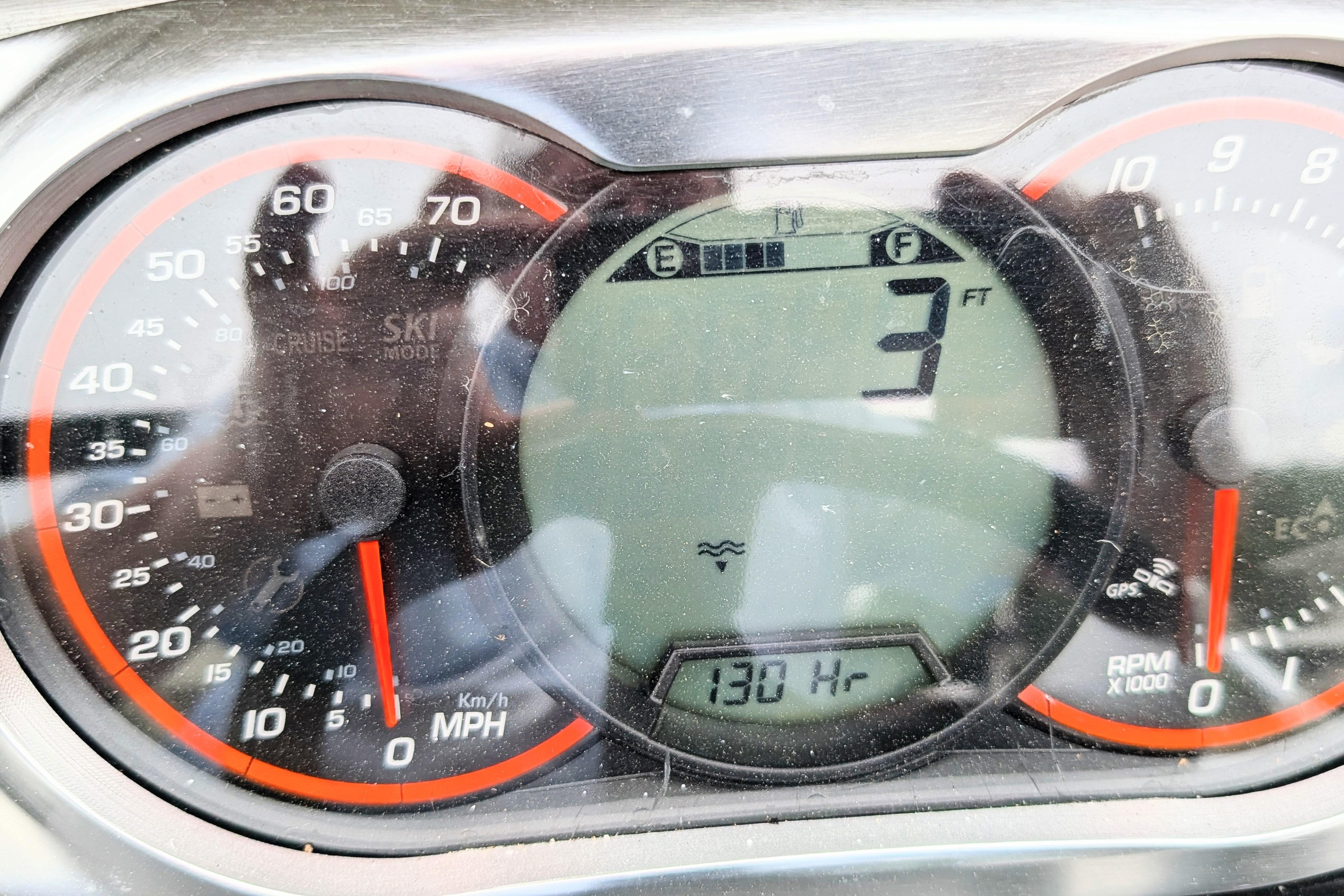 Dashboard of a 2016 Scarab 165 ID boat showing speedometer and digital display.