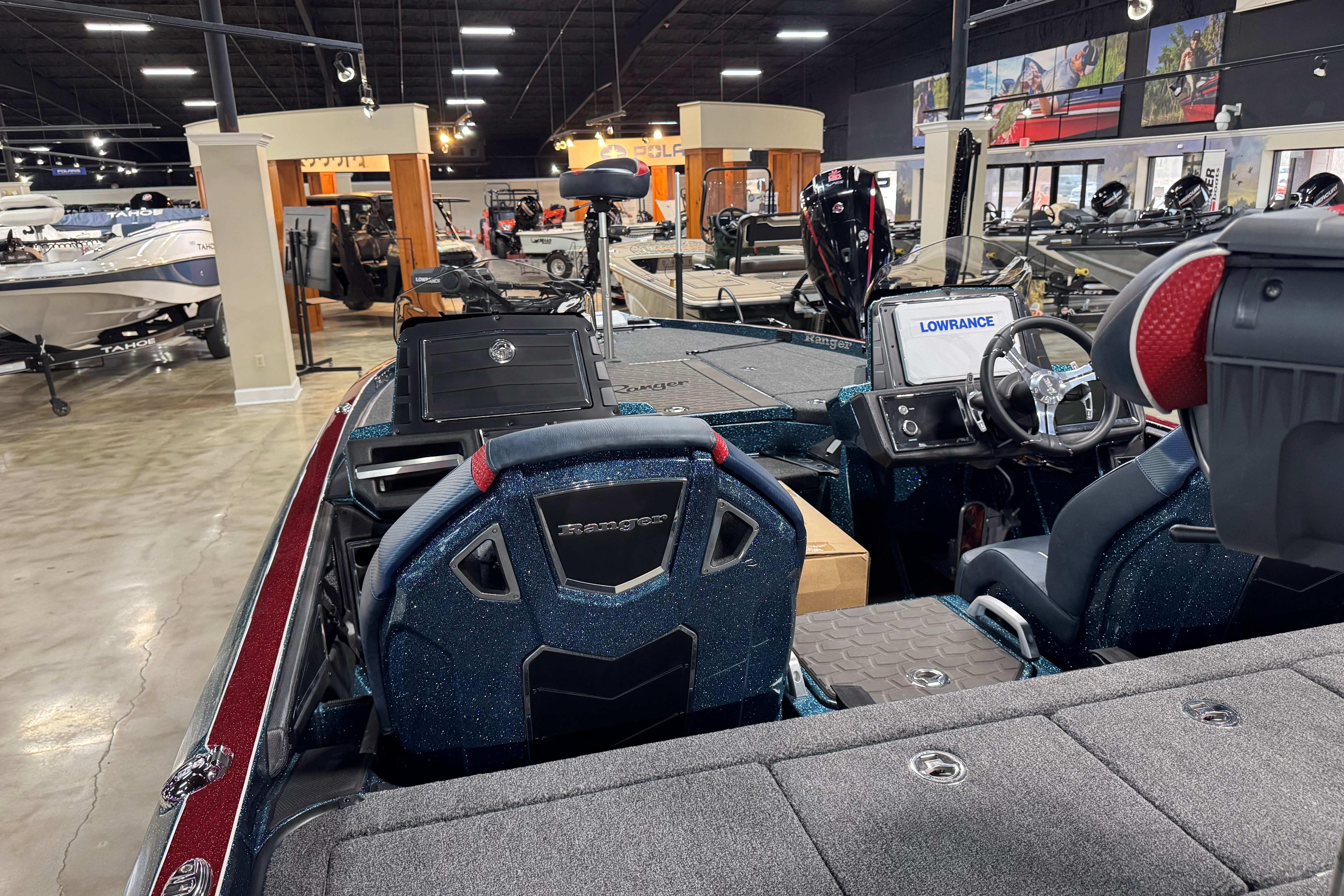 2025 Ranger Z520R Cup-Equipped boat interior in showroom, featuring advanced navigation system.