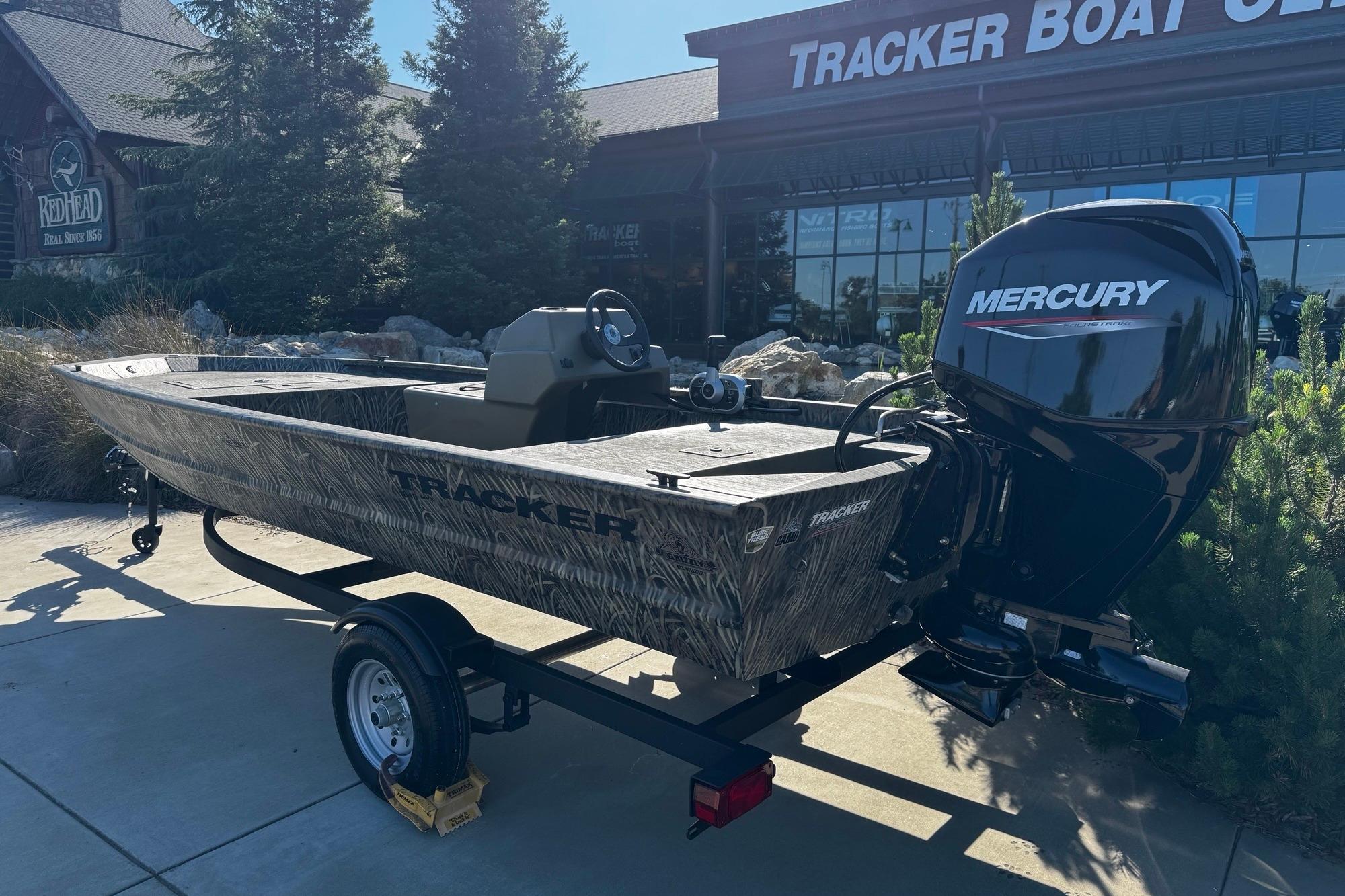 2026 Tracker Grizzly 1648 SC boat with Mercury engine outside Tracker Boat Center.