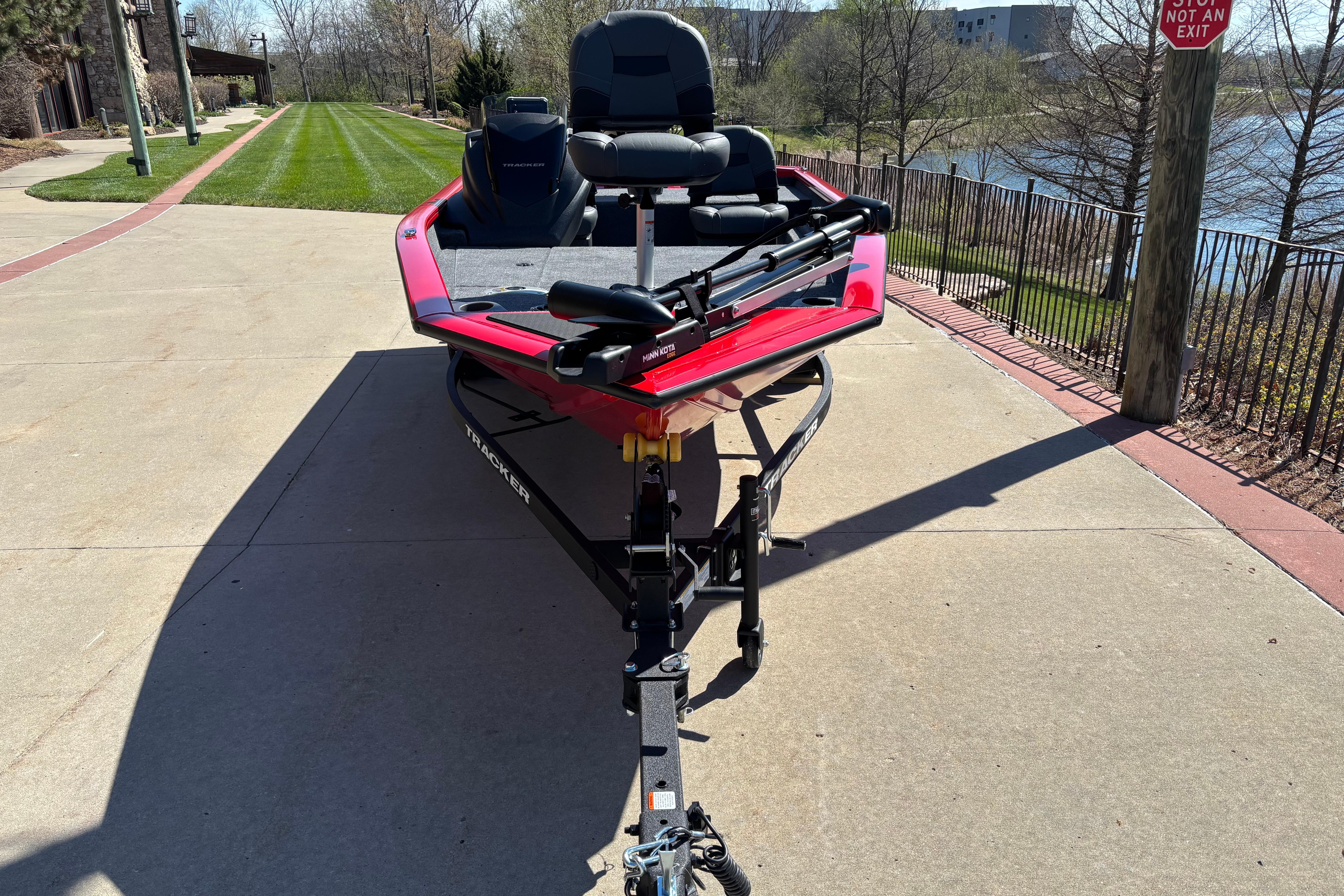 2026 Tracker Pro Team 175 Crappie Edition boat on a trailer, parked outdoors.