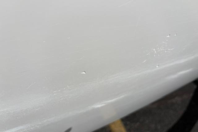 Close-up of a 2024 Tahoe T21 surface with minor scratches.