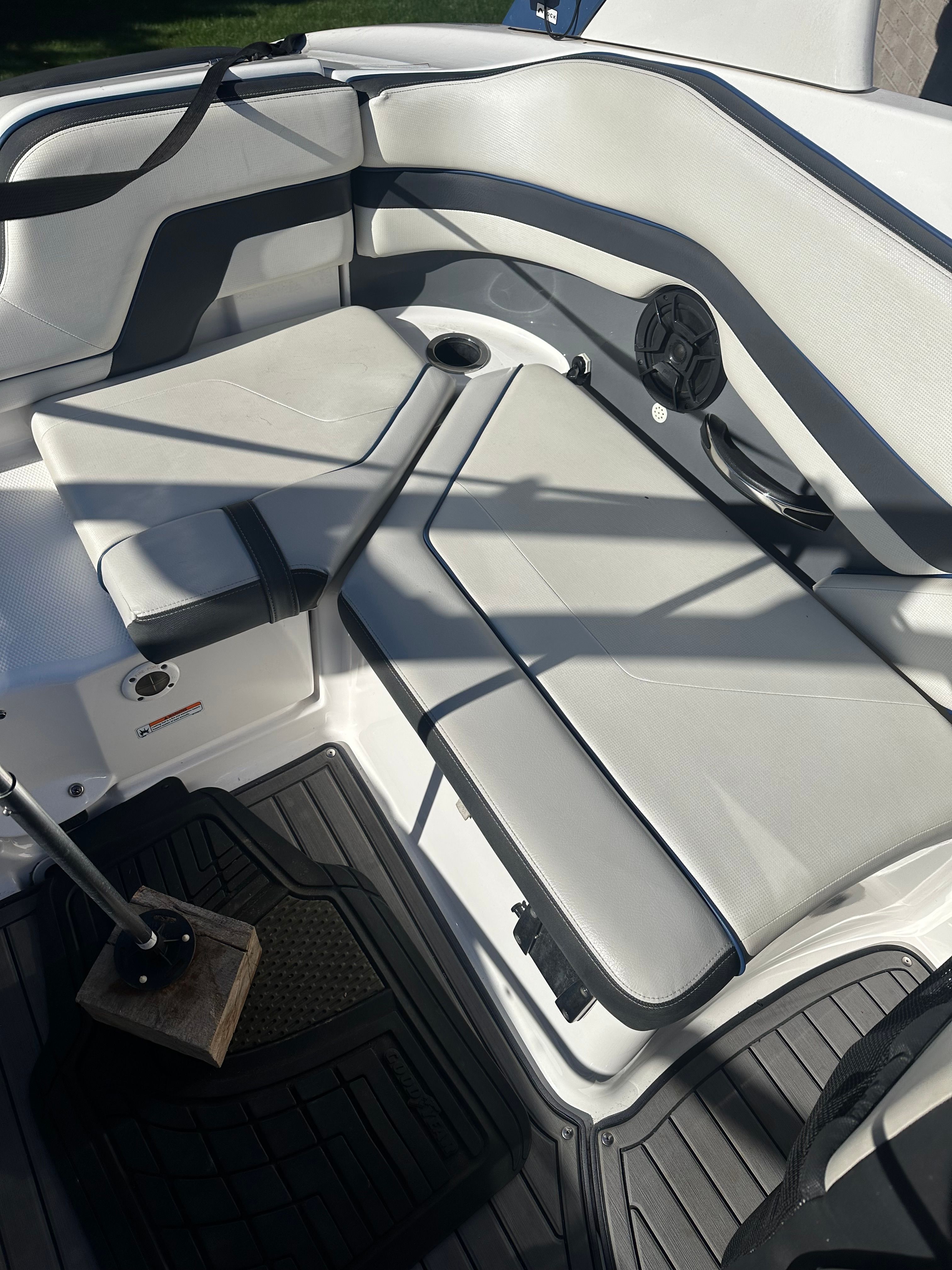 Interior of a 2018 Yamaha 242 Limited S with white upholstery and black accents.
