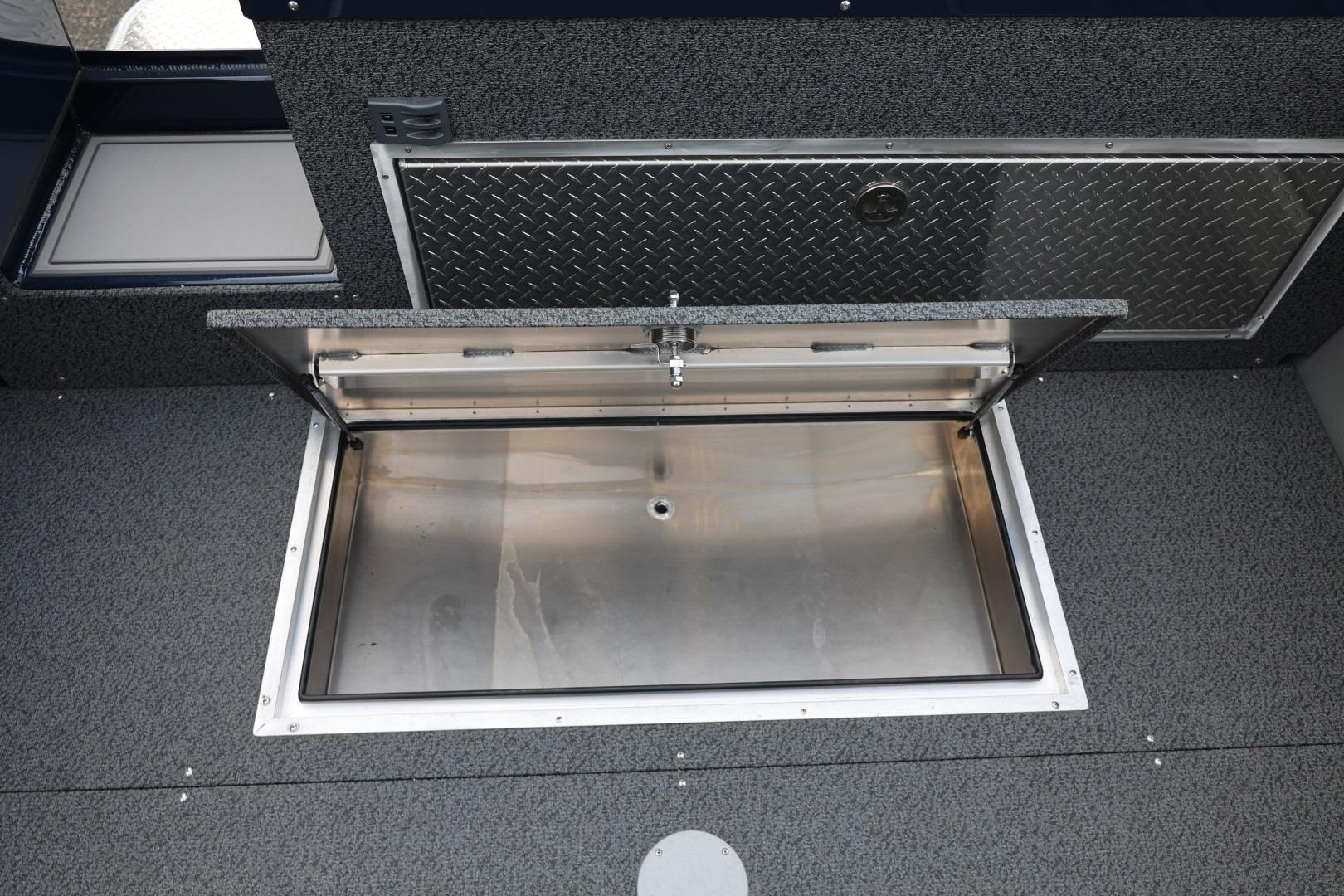 Open storage compartment in 2026 Thunder Jet 24 Alexis Pro boat interior.