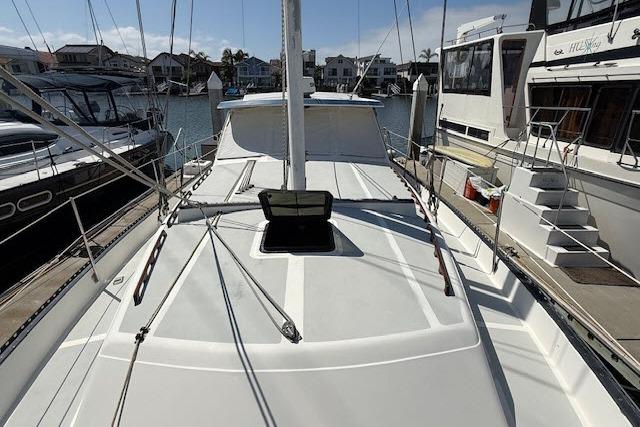 1982 Lancer 45 Motorsailer docked at marina, showcasing deck and rigging.