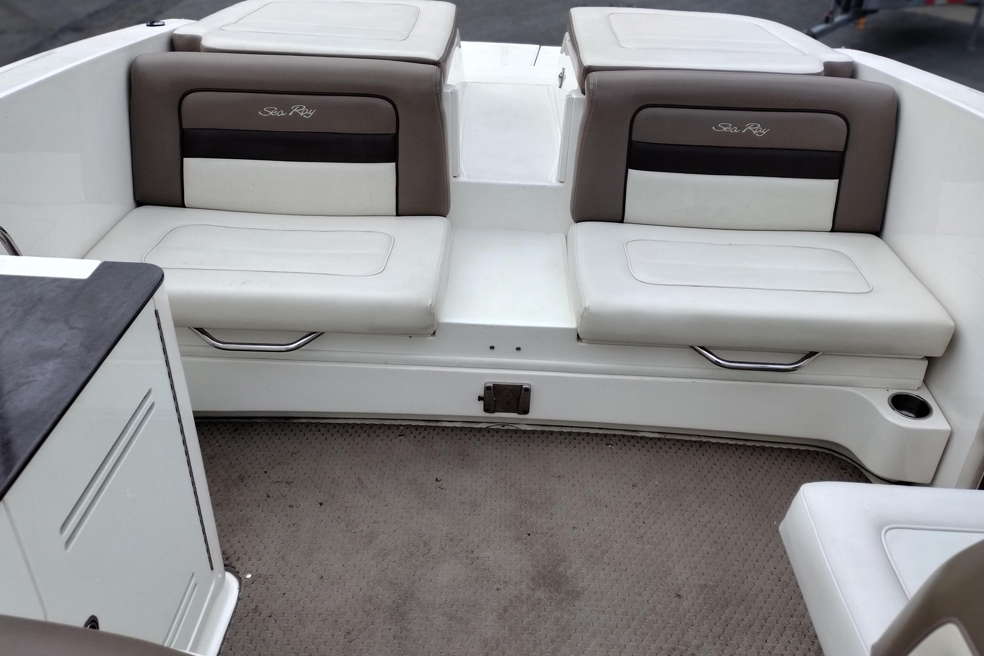 Interior seating of a 2013 Sea Ray 300 SLX boat, featuring cushioned benches.
