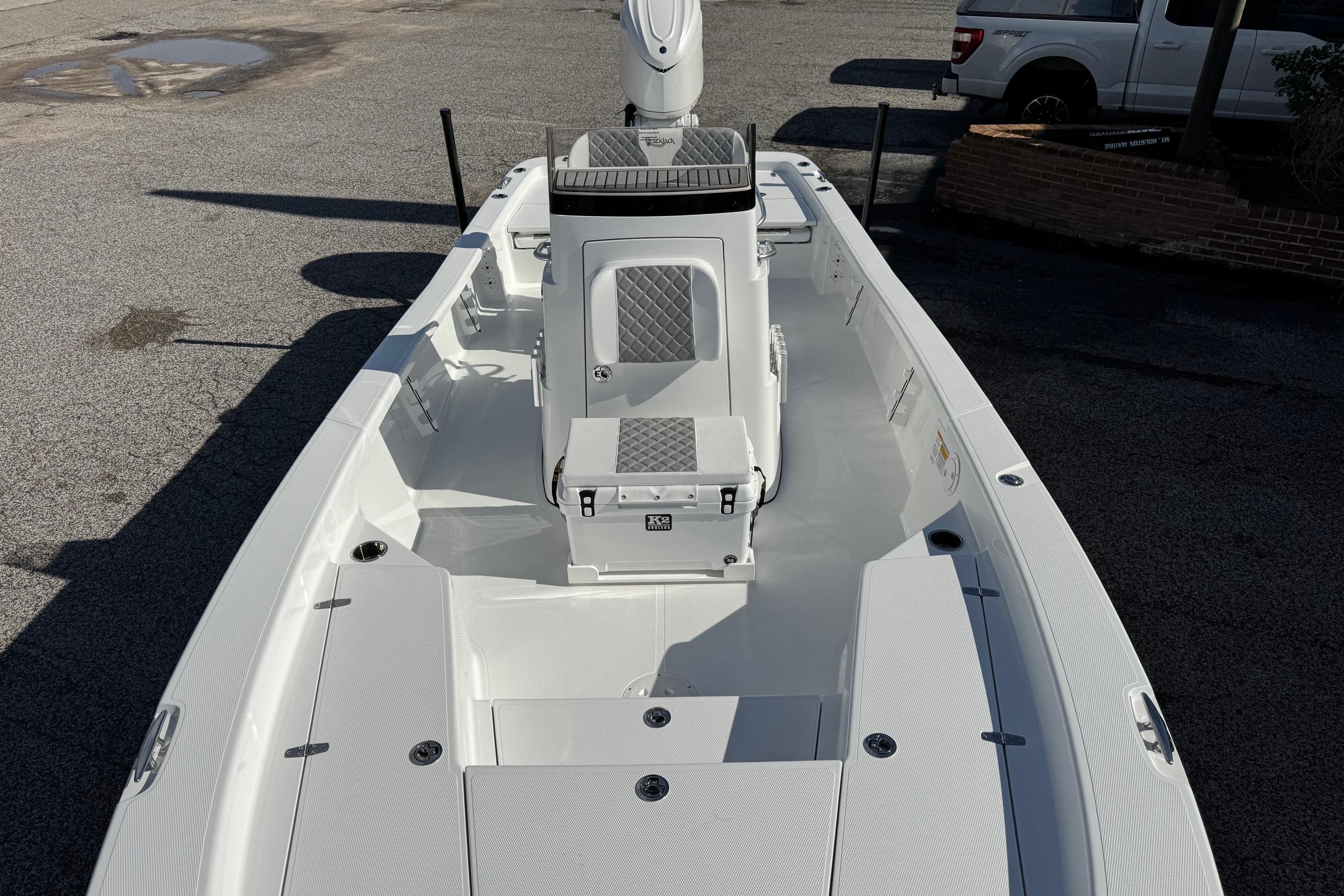 2026 BlackJack 256 Bay boat interior with sleek white design and seating.