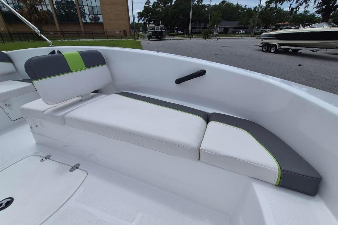 2021 Tahoe T16 boat interior with white and gray seating, featuring green accents.