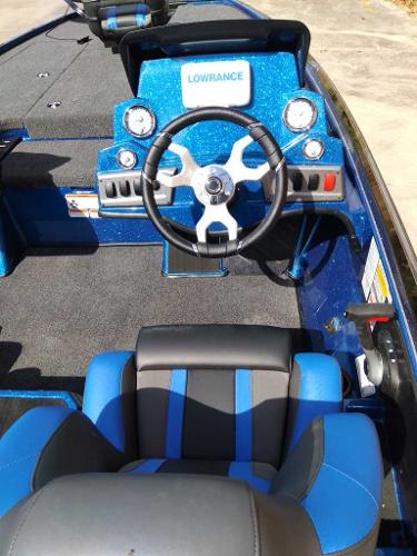 2025 Nitro Z19 boat cockpit with steering wheel and Lowrance electronics.