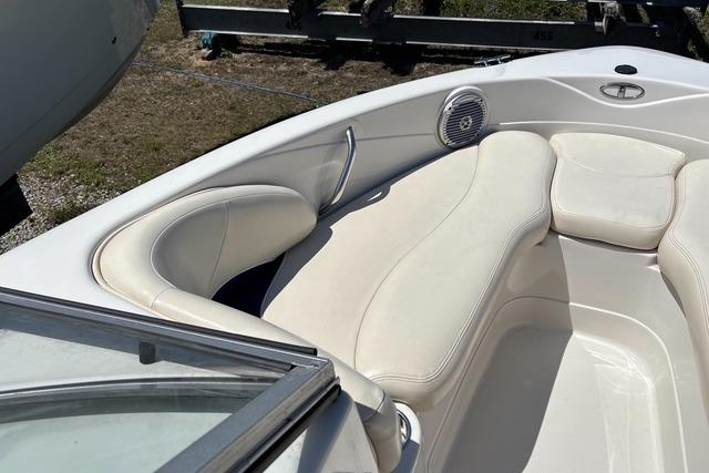 2012 Tahoe Q8 SSi boat interior with white cushioned seating and speaker.
