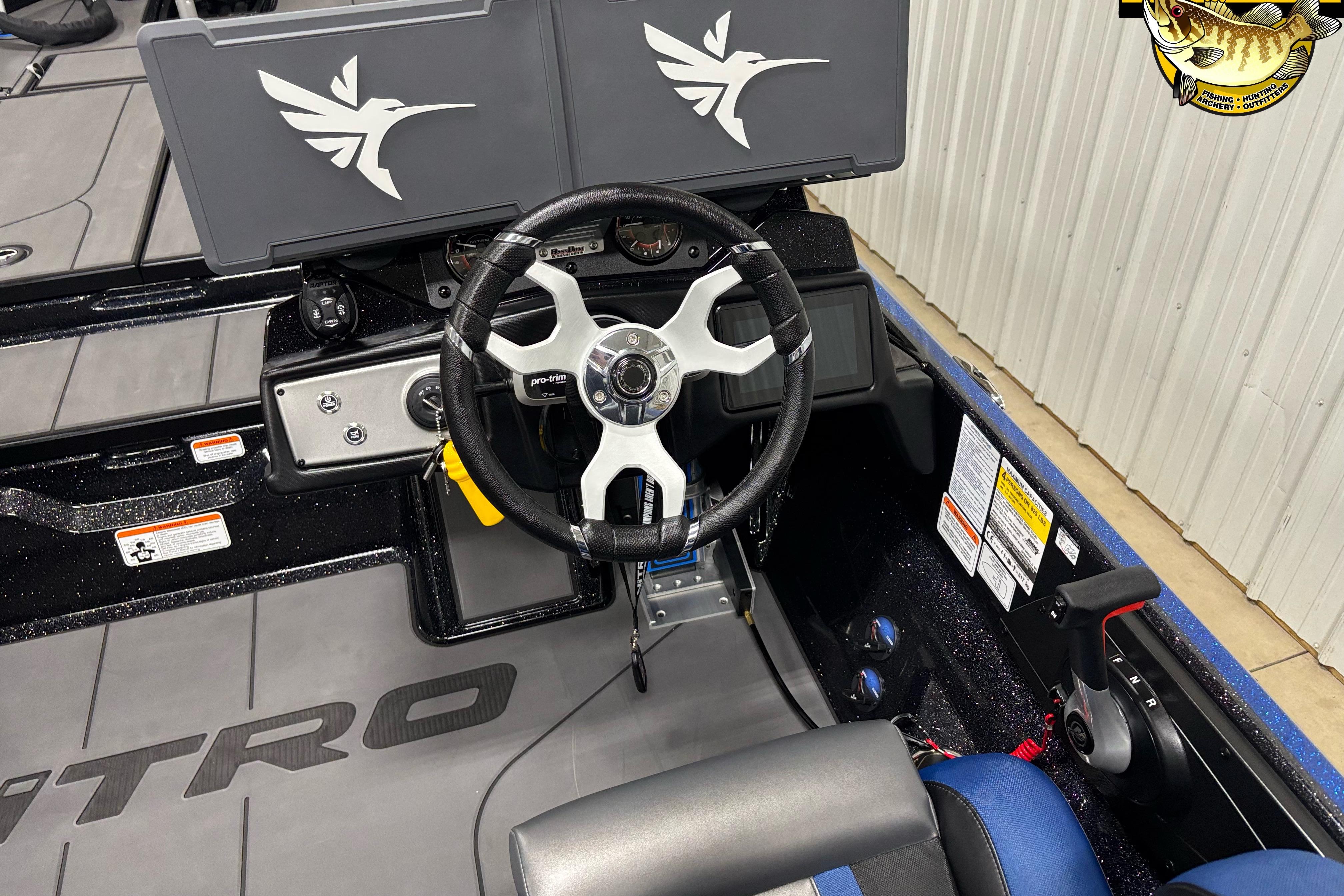 2026 Nitro Z21 XL boat cockpit with steering wheel and control panel.