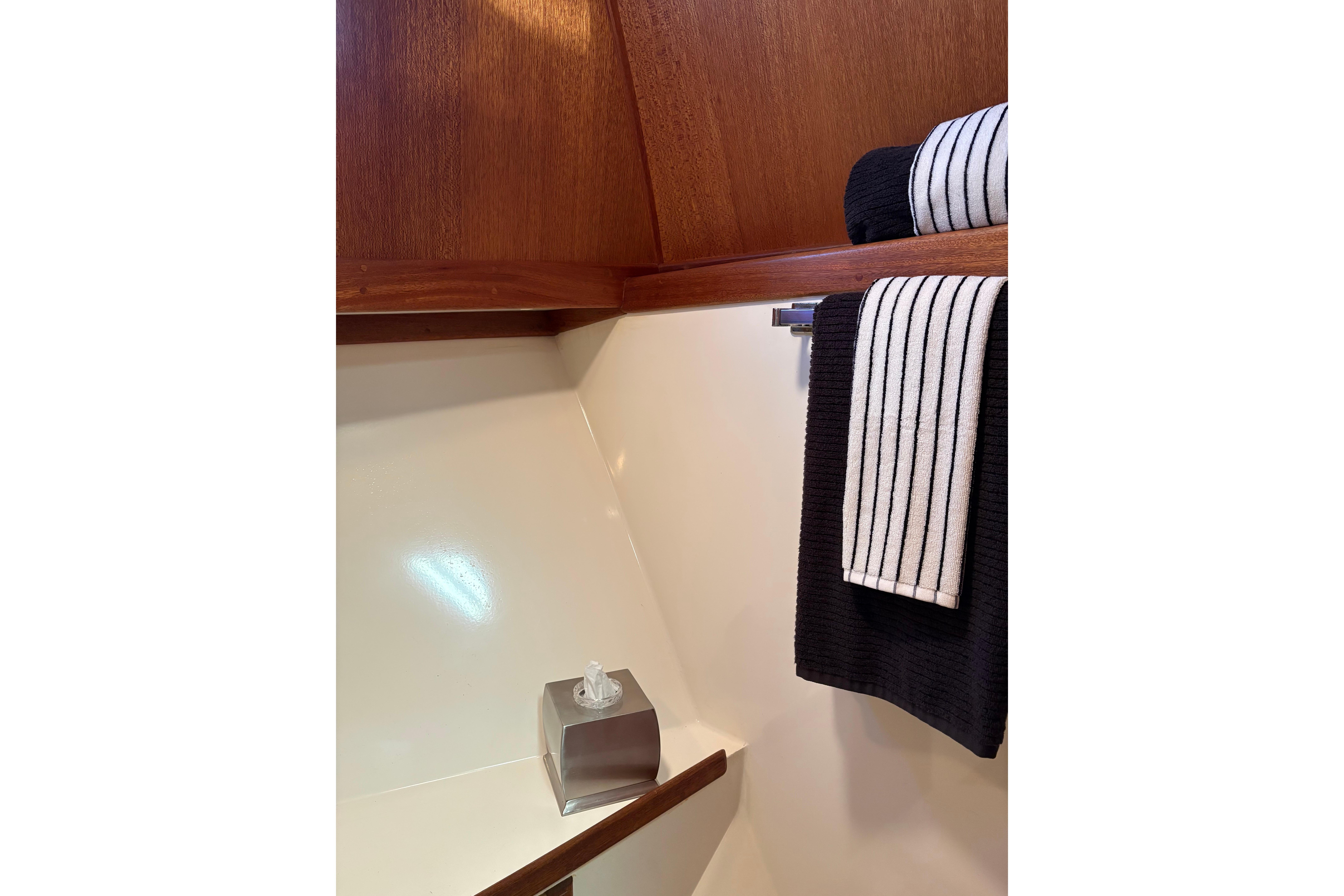 1978 Californian 42 LRC yacht bathroom with wooden accents and striped towels.