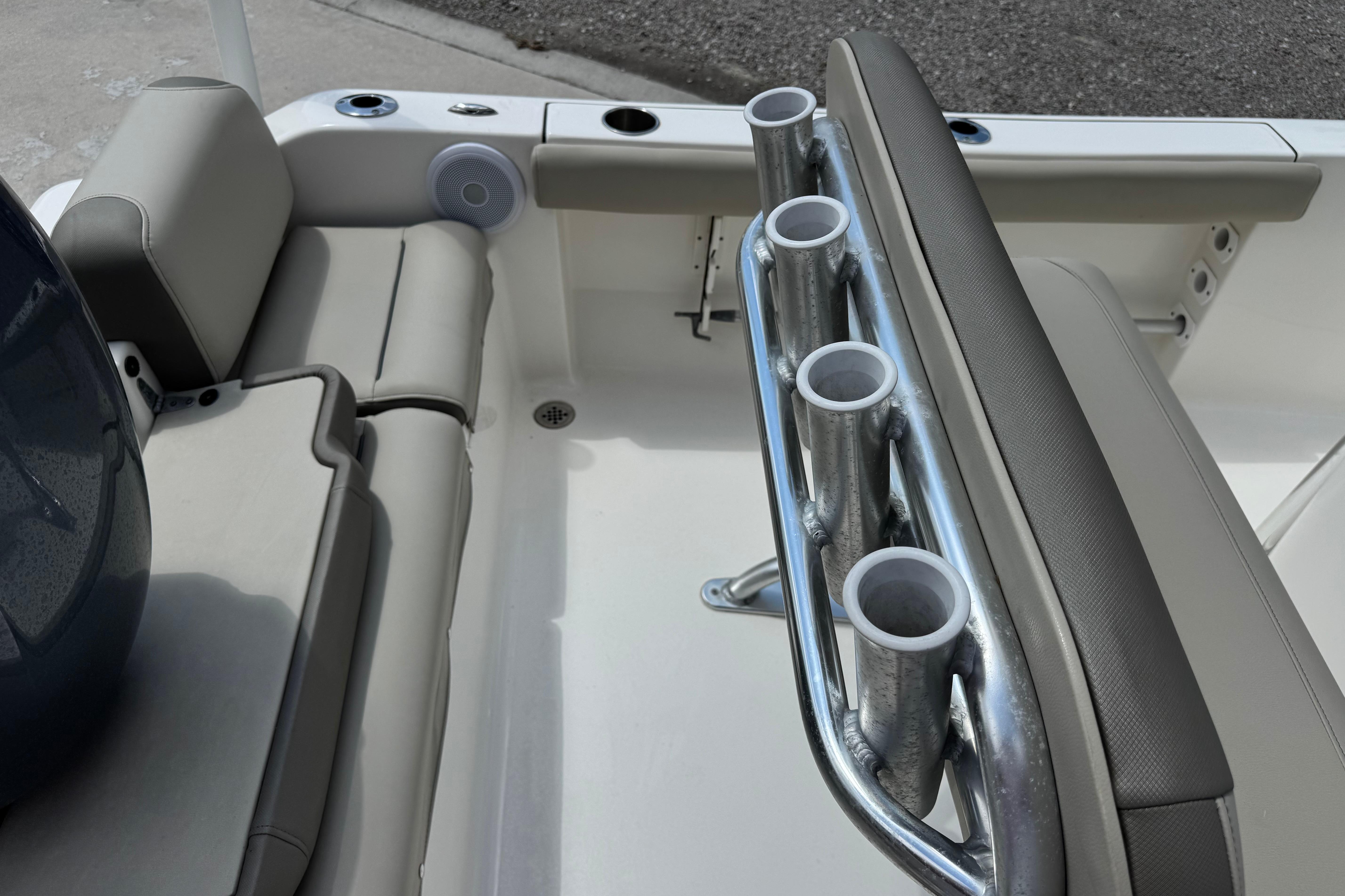 2022 Key West 189 FS boat interior with rod holders and cushioned seating.
