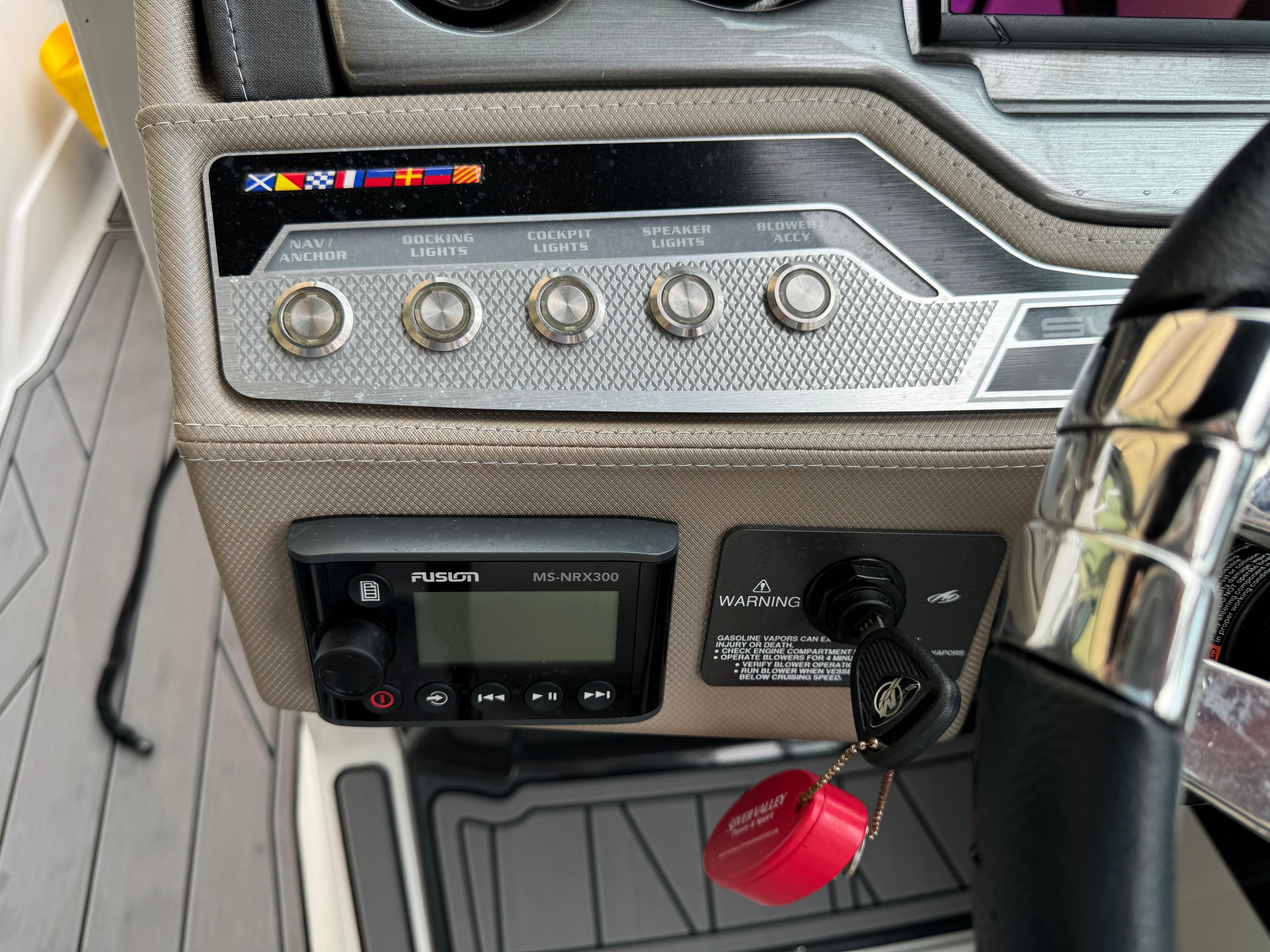 Control panel of 2022 Monterey 278 Super Sport boat with various switches and a Fusion stereo.