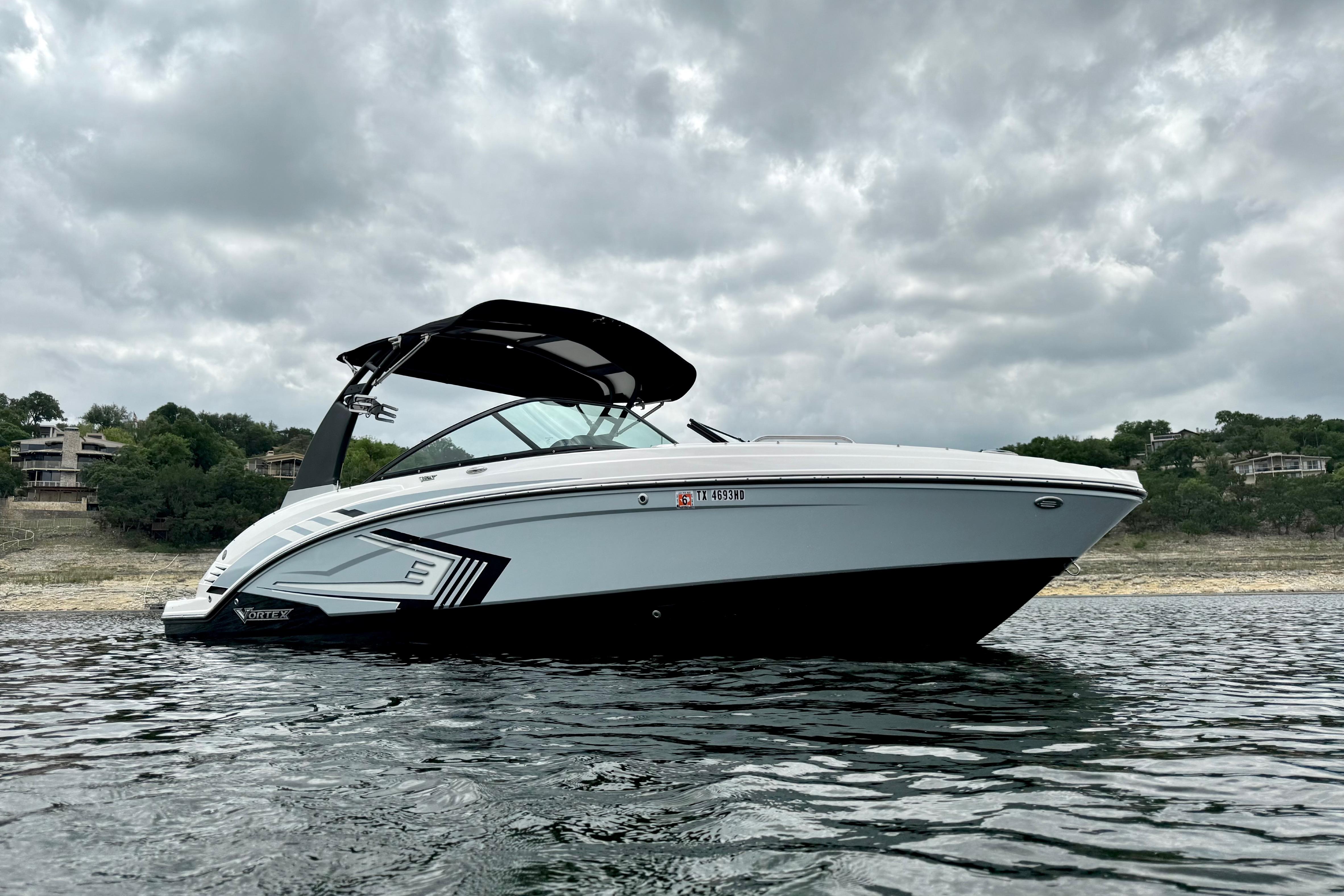 2019 Chaparral Vortex 223 VRX boat on water under cloudy sky.