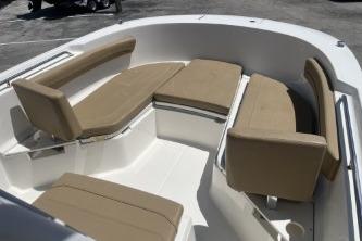 2023 Trophy T24 CC boat interior with beige seating and spacious layout.