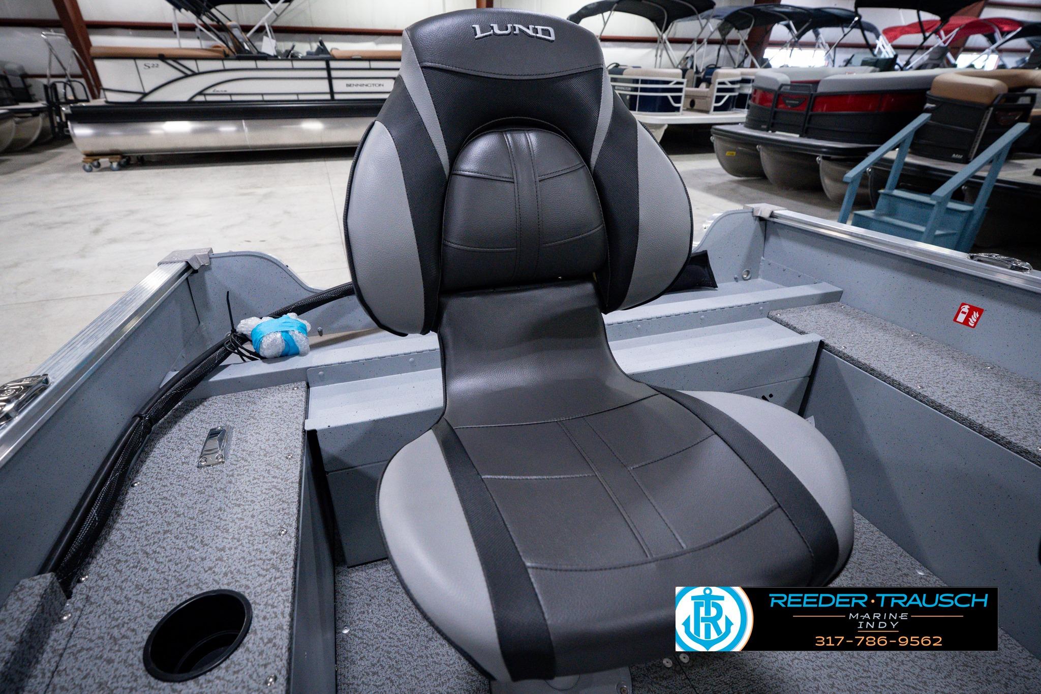 Lund 1600 Fury SS 2026 boat seat in showroom, featuring sleek black and gray design.