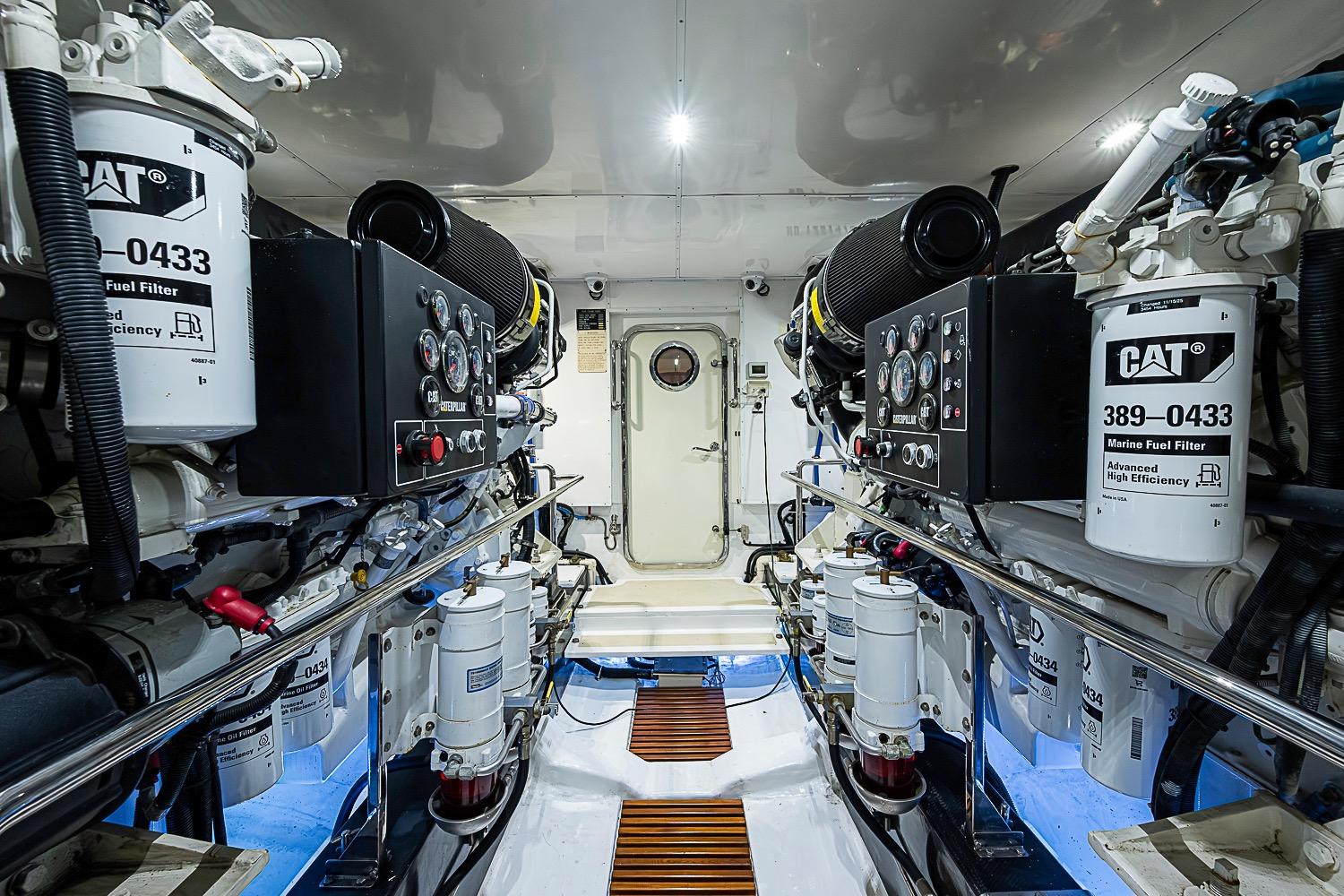 Engine room of 2014 Marlow 80 Explorer yacht with CAT marine fuel filters.