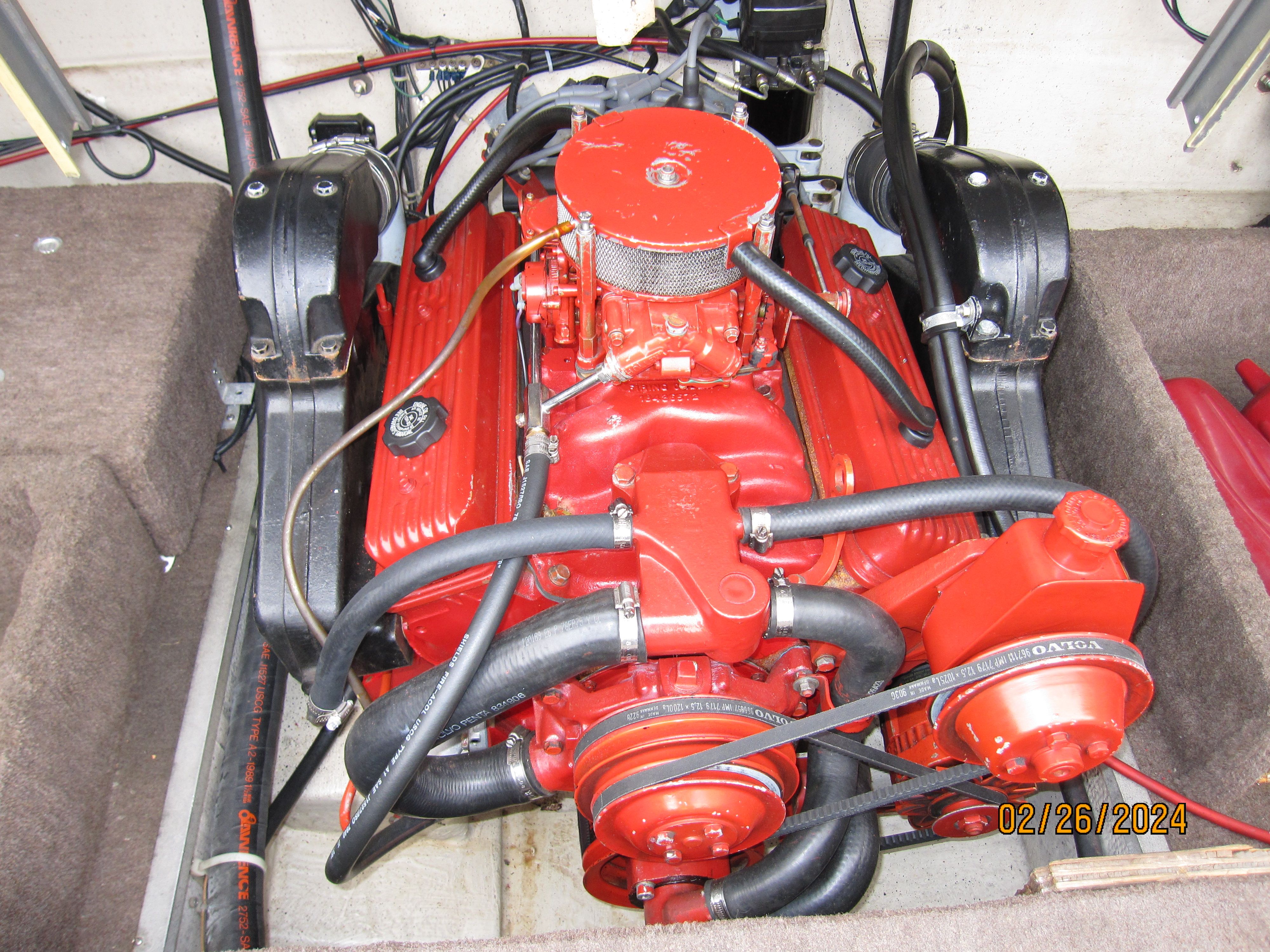 Engine of a 1990 Cobalt Bowrider Classic boat, painted red.