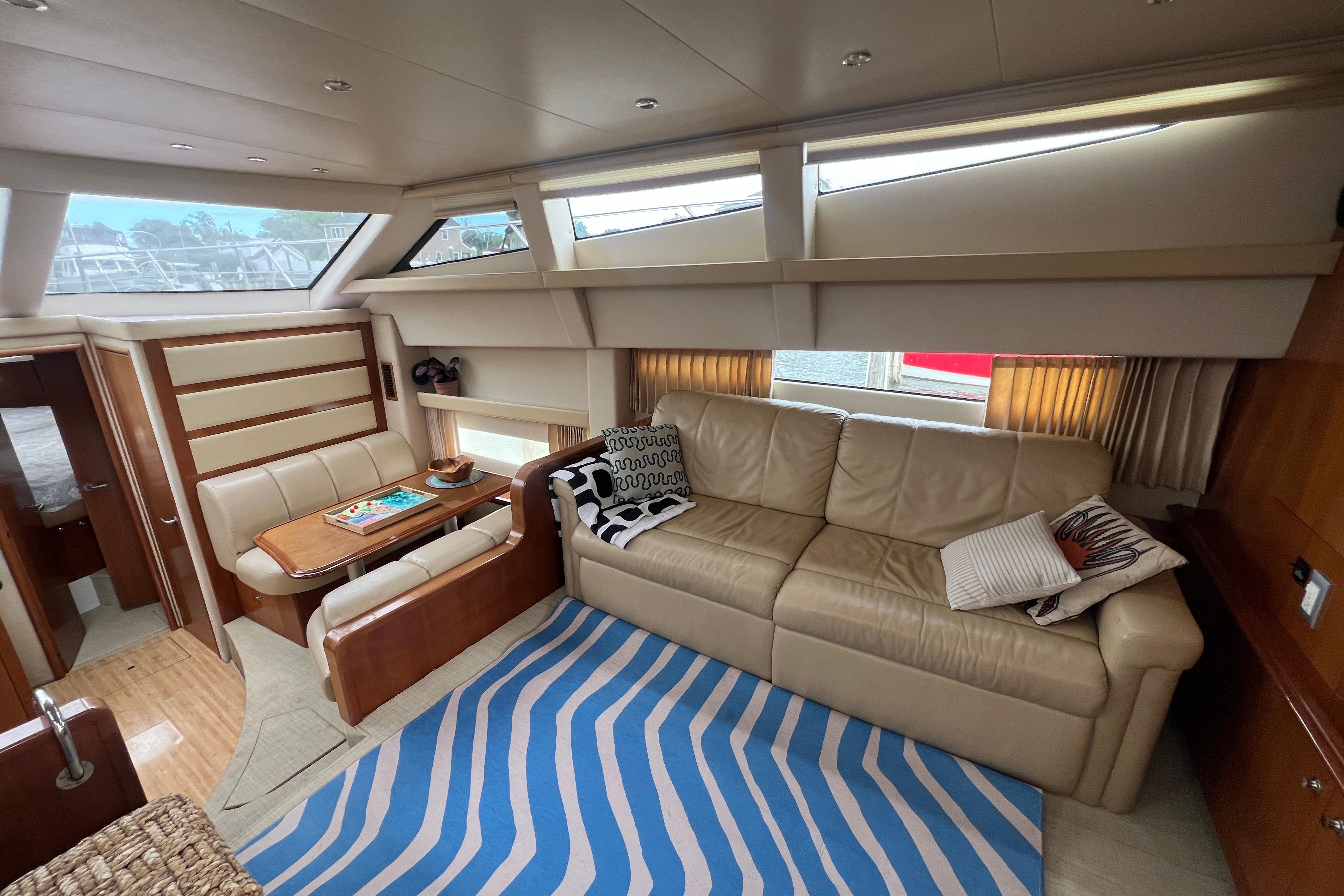Luxurious interior of 2006 Carver 43 Motor Yacht with leather seating and modern decor.