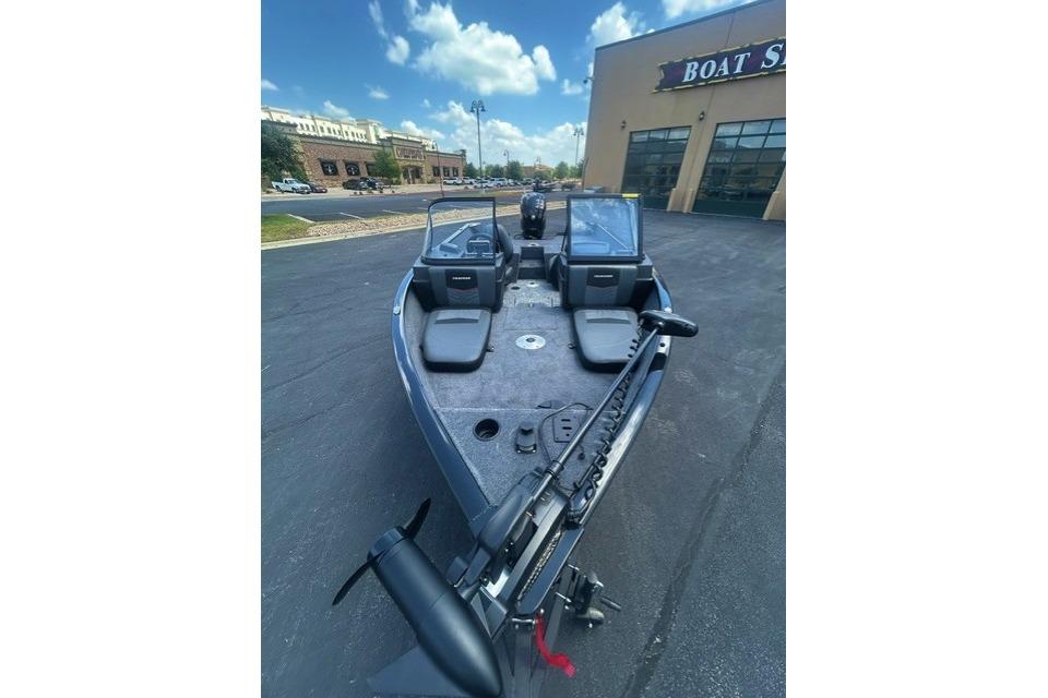 2026 Tracker Pro Guide V-175 Combo boat displayed outside a dealership under a blue sky.
