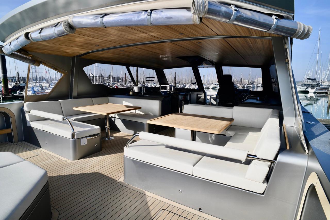 Luxurious 2024 Sunmare 50 Hybrid Catamaran with spacious outdoor seating and elegant wooden accents.