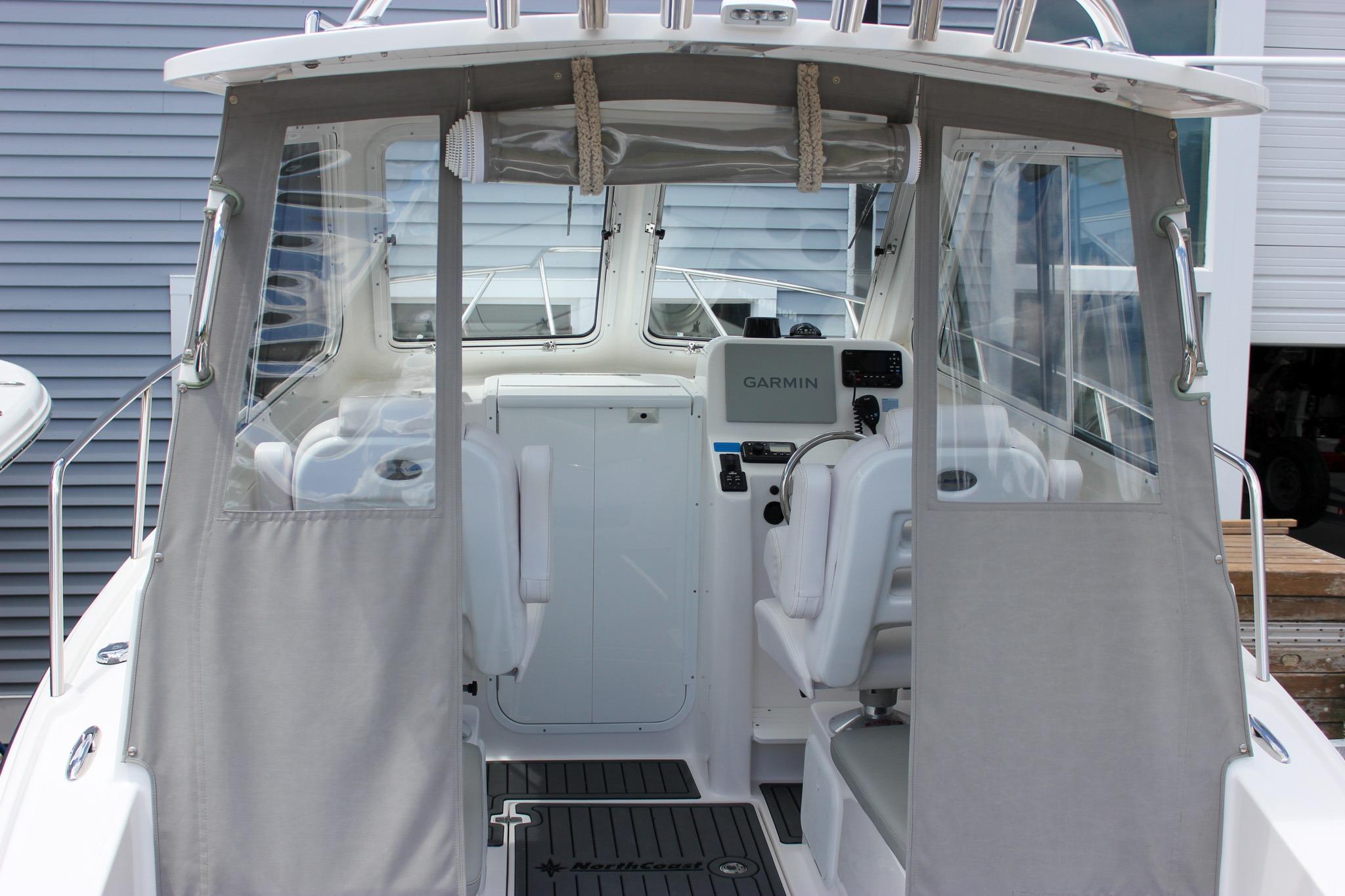 2022 NorthCoast 235 Cabin boat interior with Garmin navigation system.
