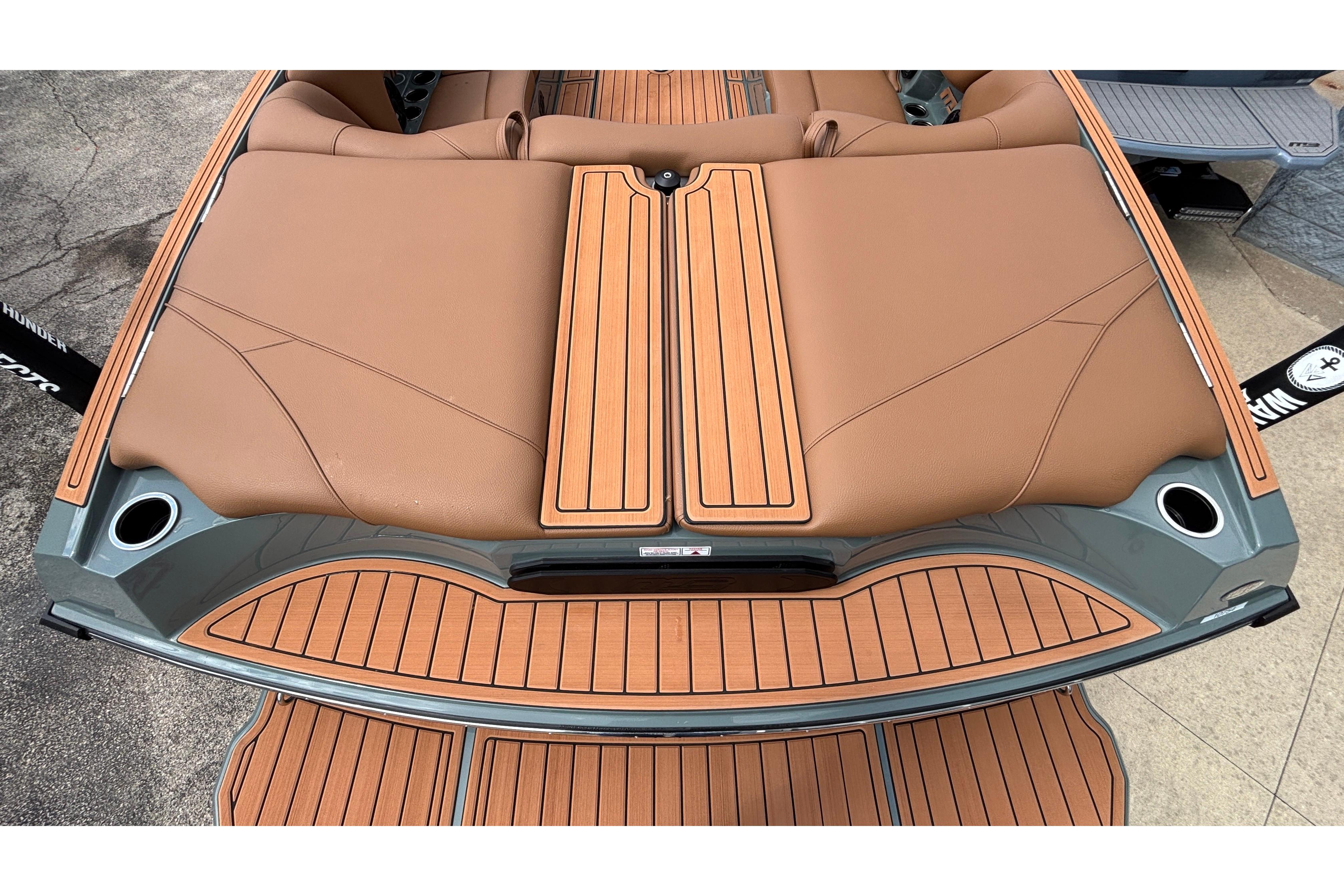 2026 MB B52 23 Classic boat with tan leather seating and wood-style deck.