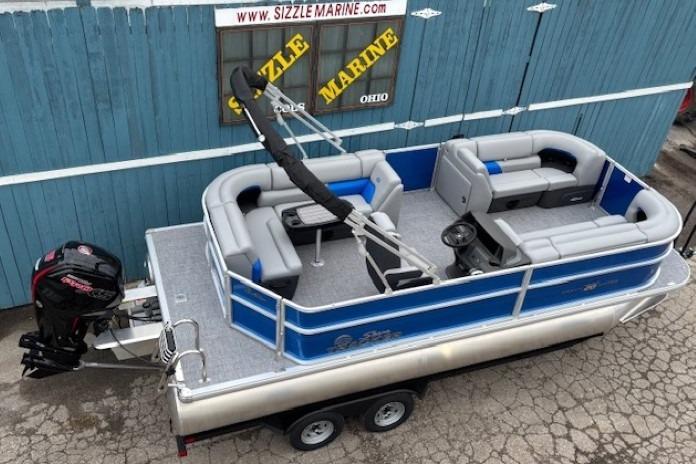 2026 Sun Tracker Party Barge 20 DLX pontoon boat with trailer, displayed at Sizzle Marine.