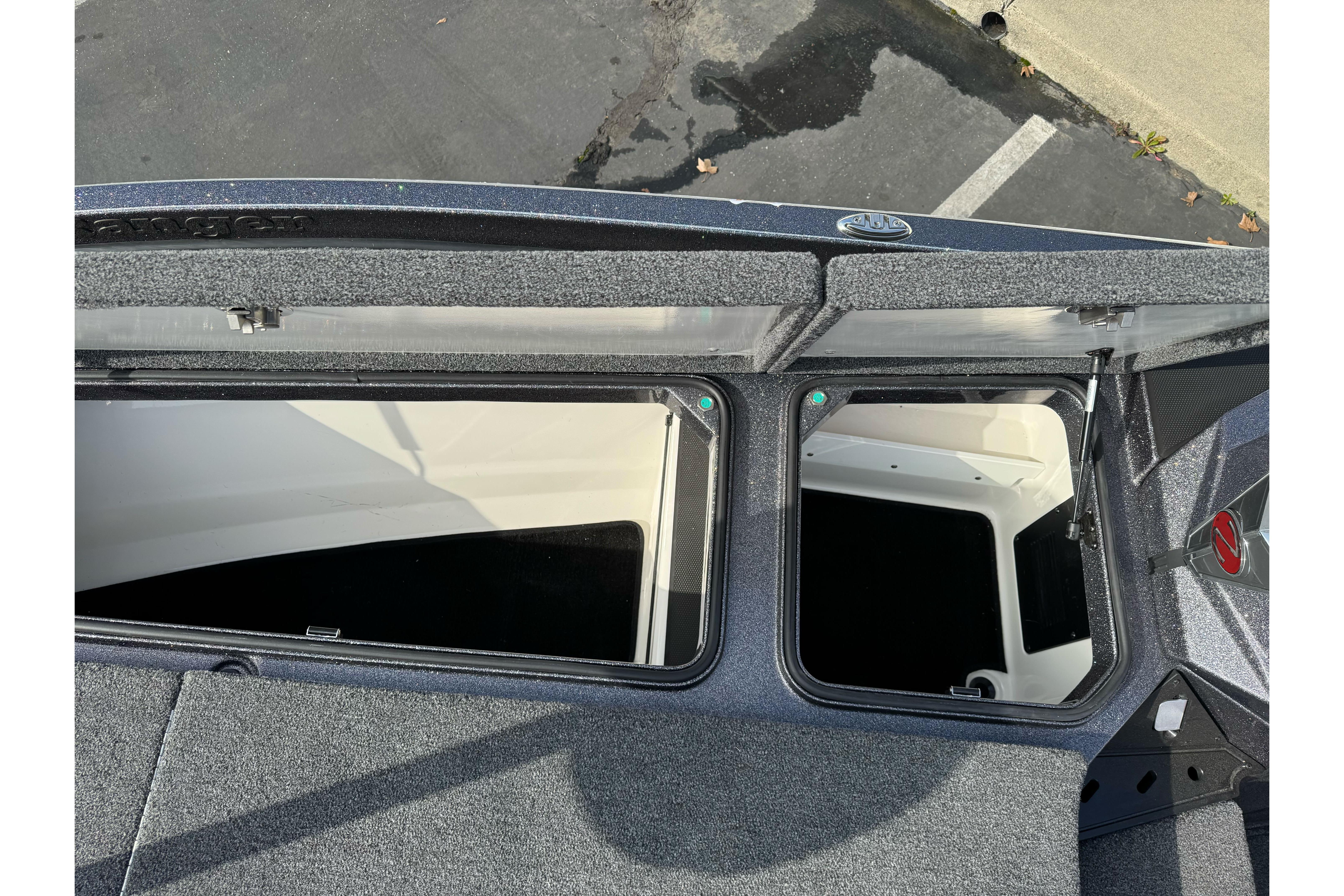 2025 Ranger Z521 boat storage compartments with open lids, showcasing interior space.