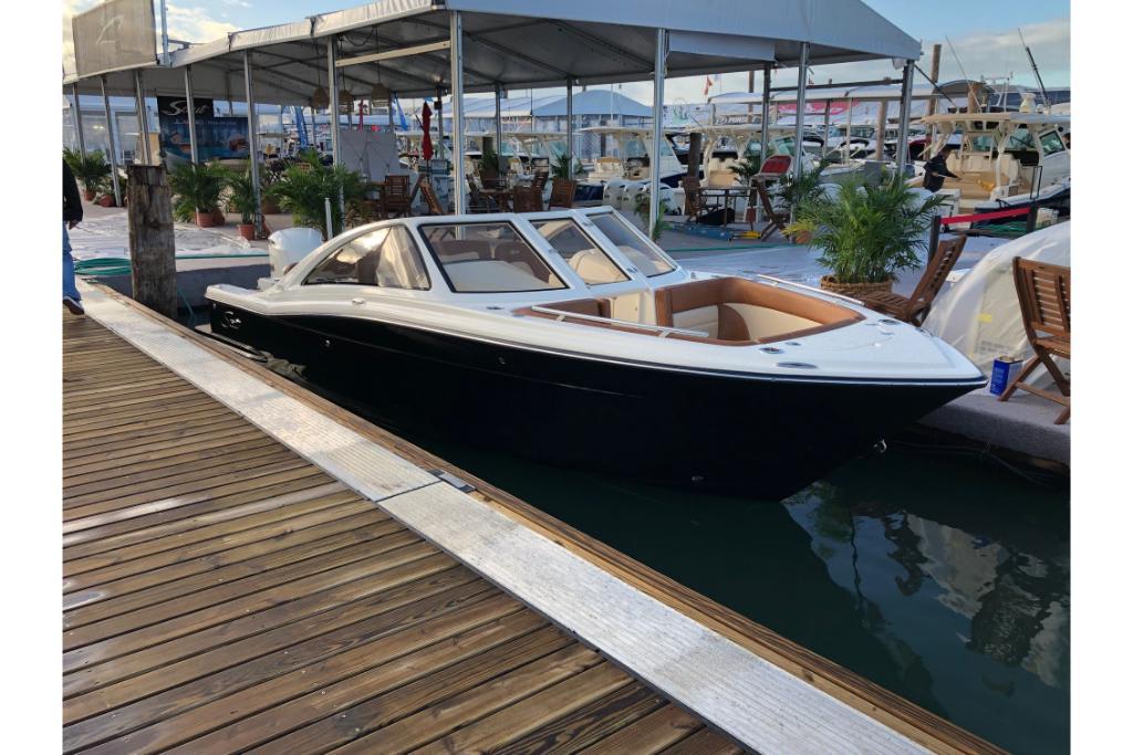 2023 Scout 240 Dorado boat docked at marina, showcasing sleek design and luxury features.