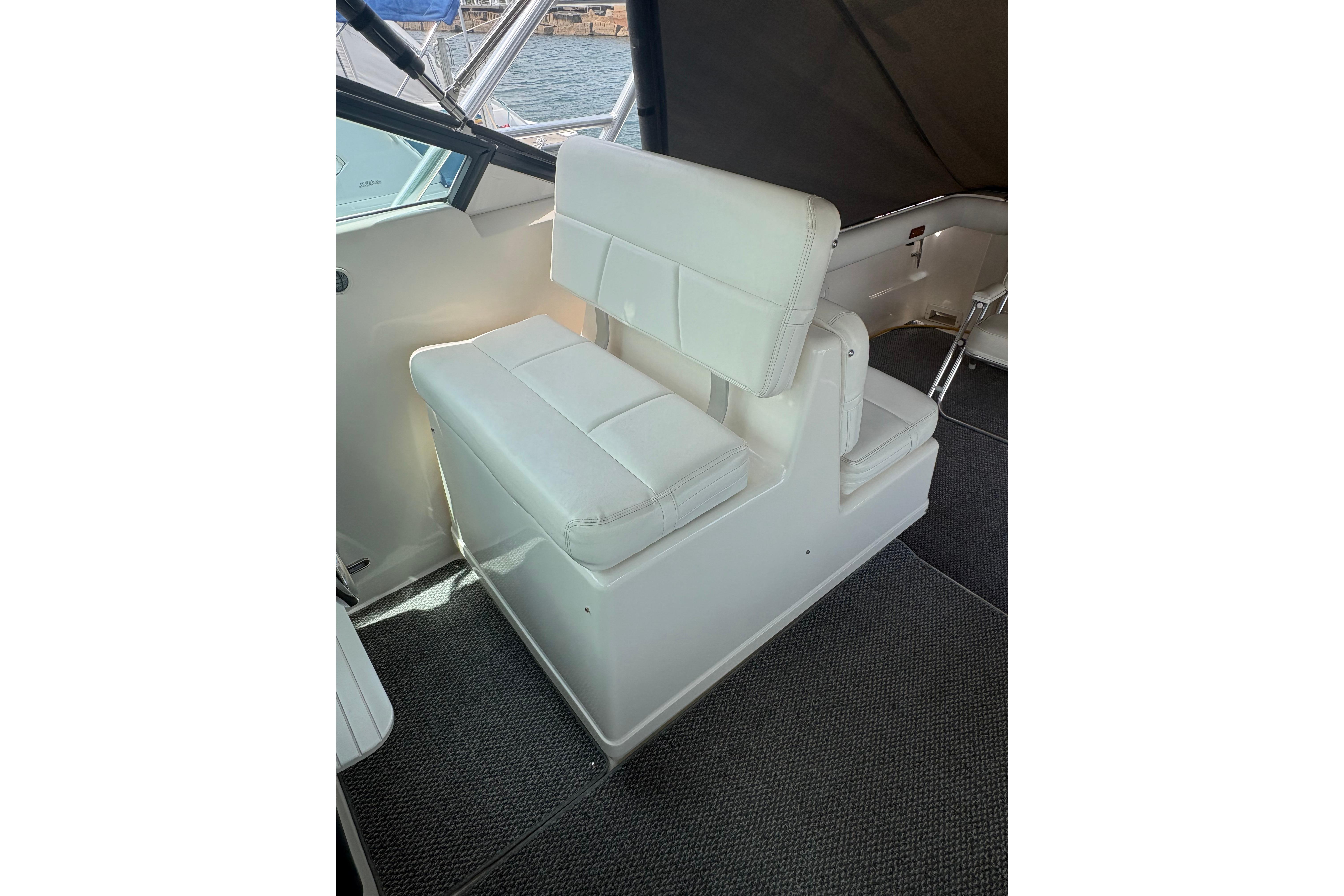 White seating on 1999 Tiara Yachts 3100 Open, featuring sleek design and comfortable upholstery.