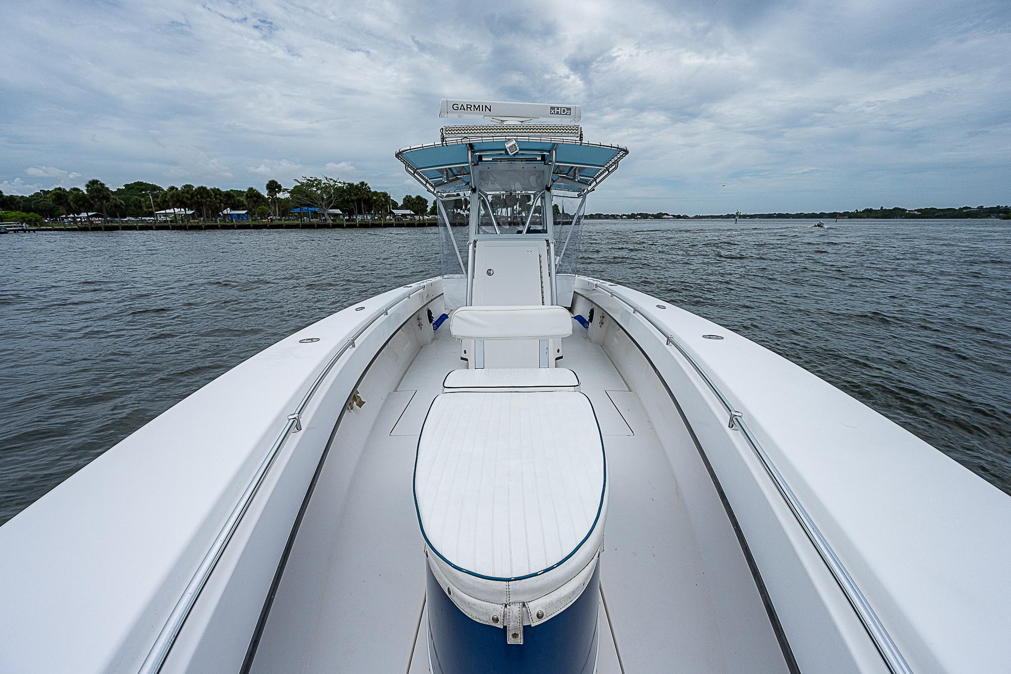 2004 Contender 36 Open boat on calm waters with a clear sky.