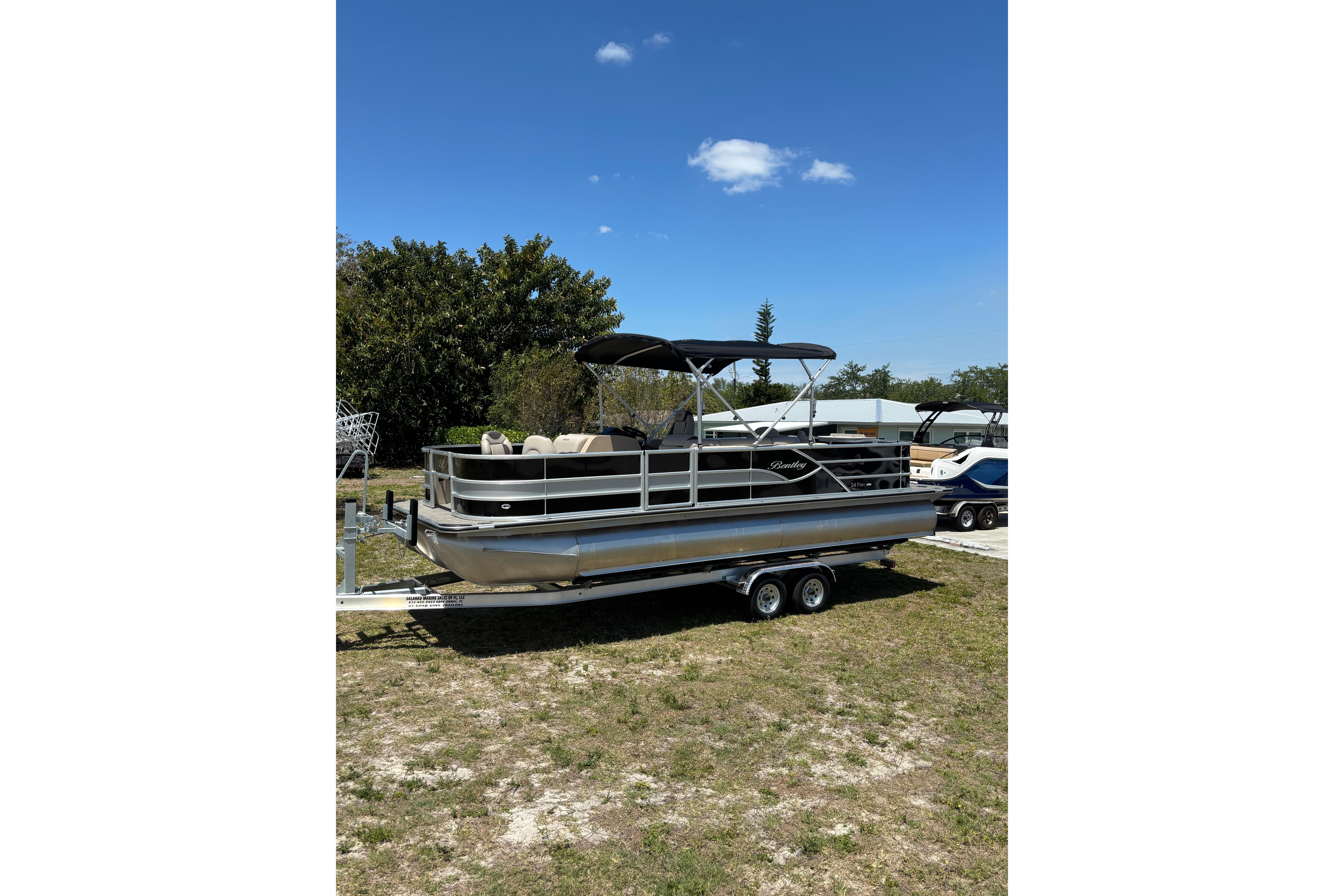 2026 Bentley Pontoons Fish 243 4-Point on trailer outdoors.