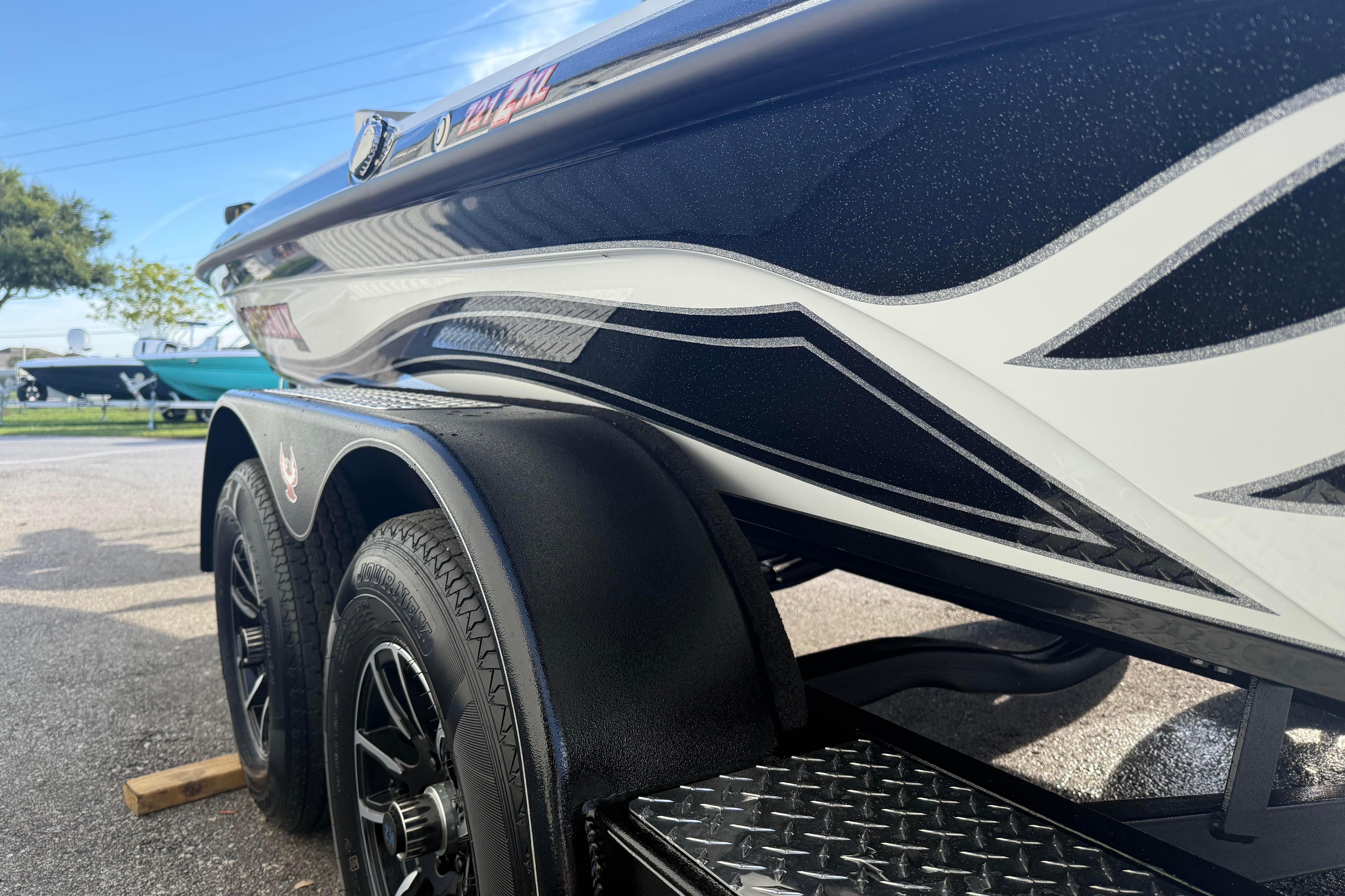 2027 Phoenix 721 ZXL boat trailer with sleek black and white design.