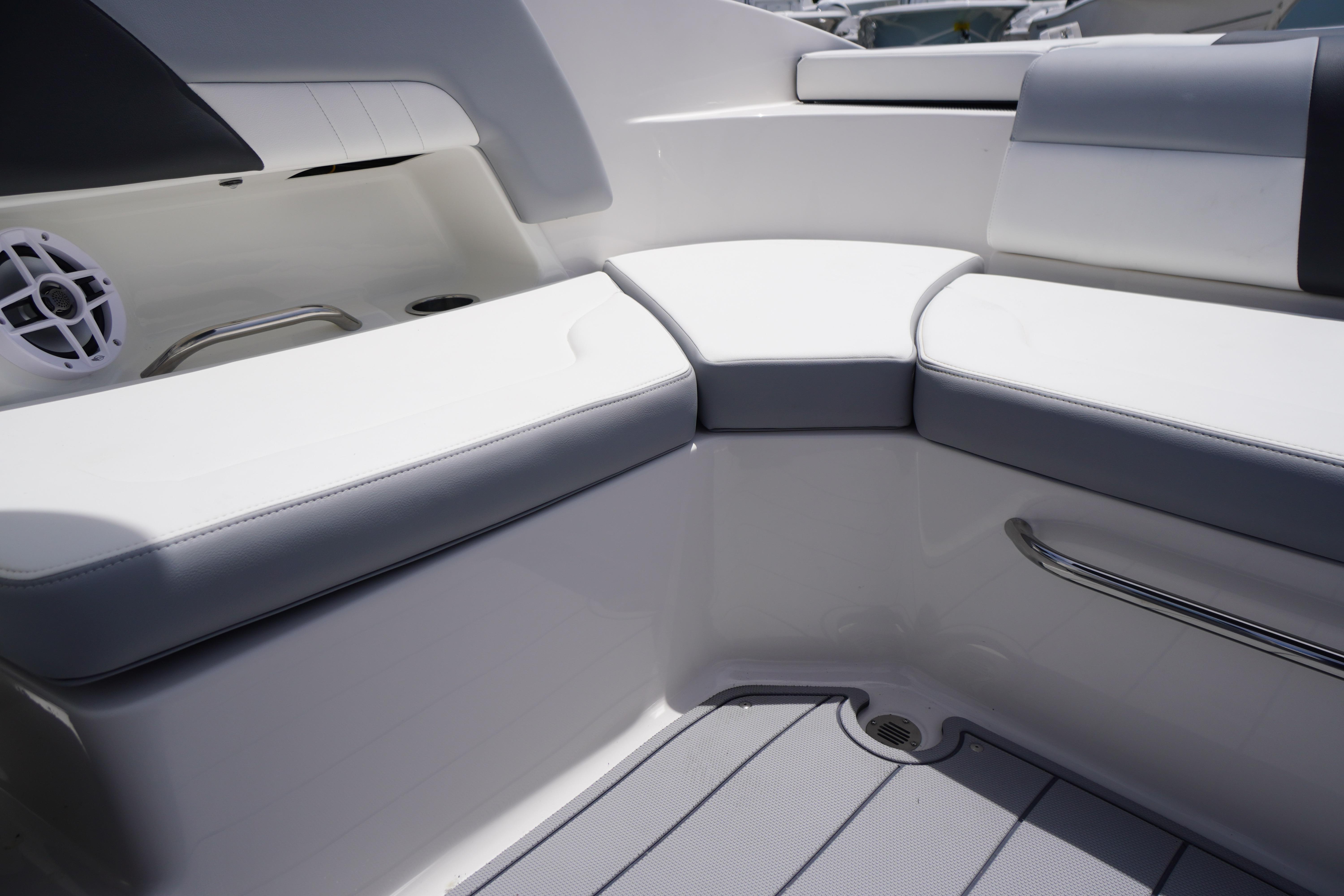 Interior seating of 2026 Chaparral 23 SSi OB boat, featuring white cushioned seats.