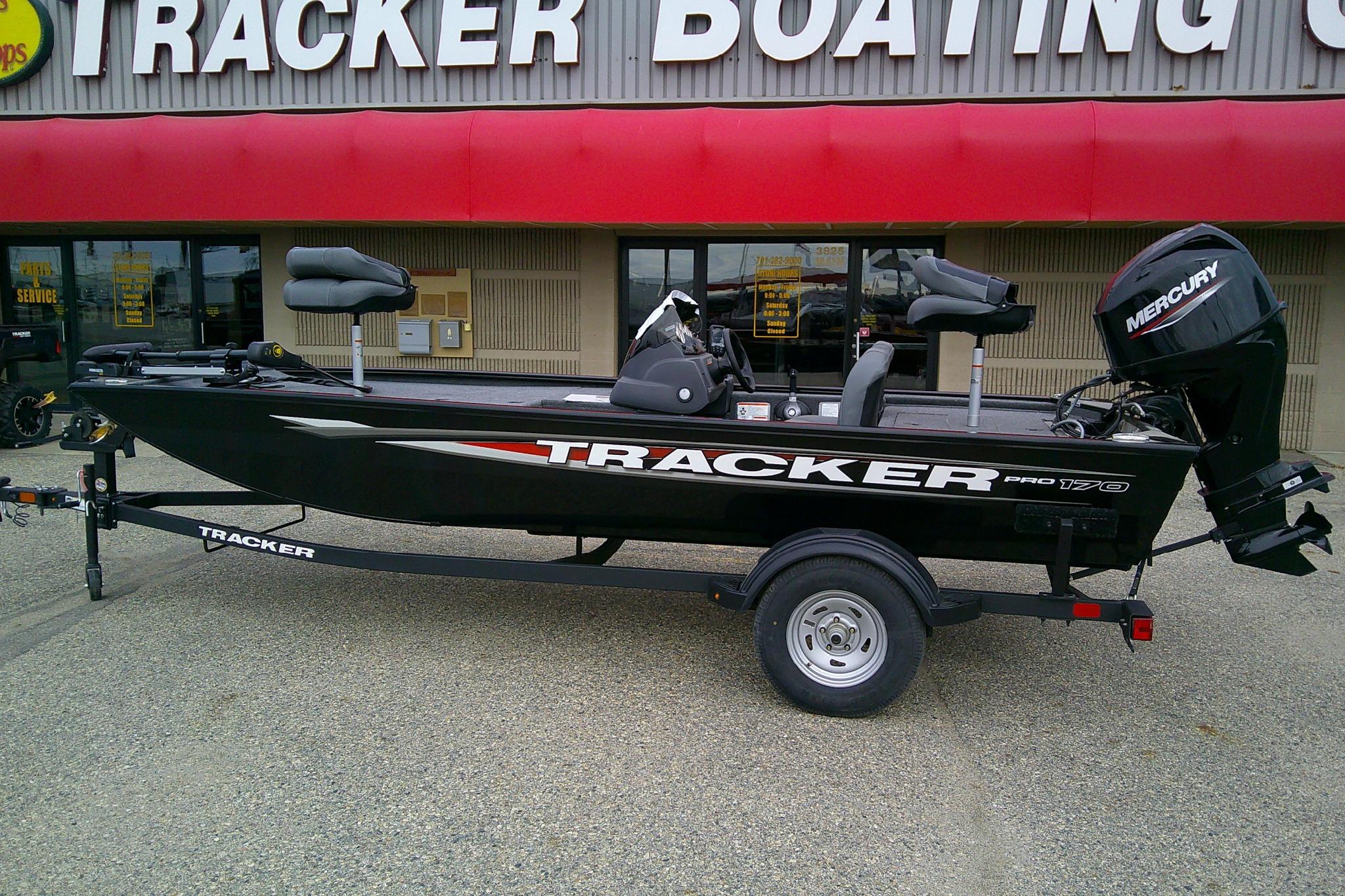 2025 Tracker Pro 170 boat with Mercury engine at dealership display.