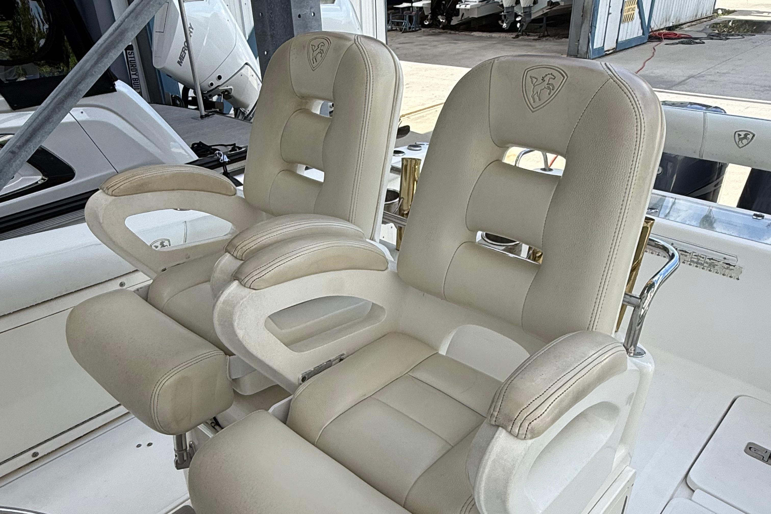 Luxurious seating on a 2008 Century 2901 Center Console boat, featuring plush white upholstery.