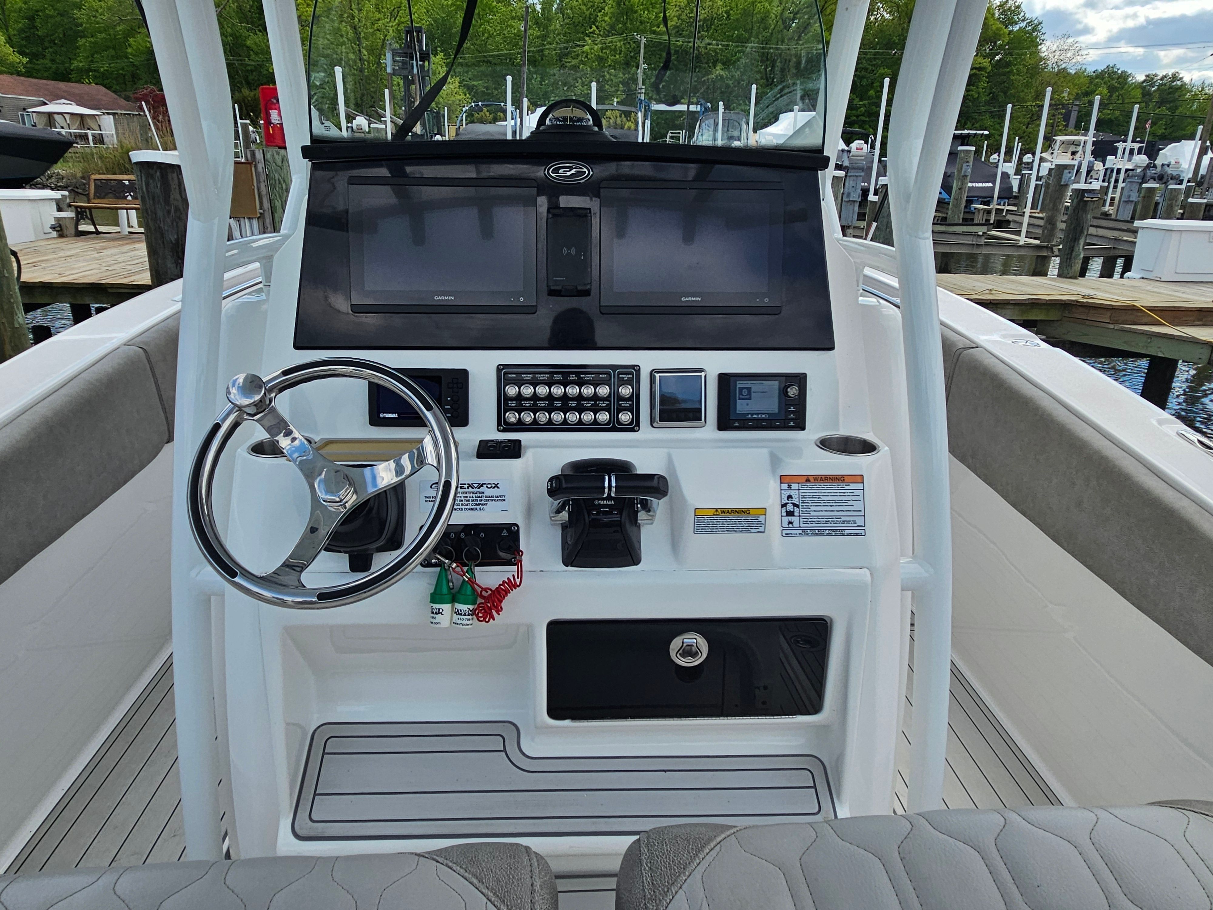 Helm console of a 2021 Sea Fox 288 Commander boat at the dock.