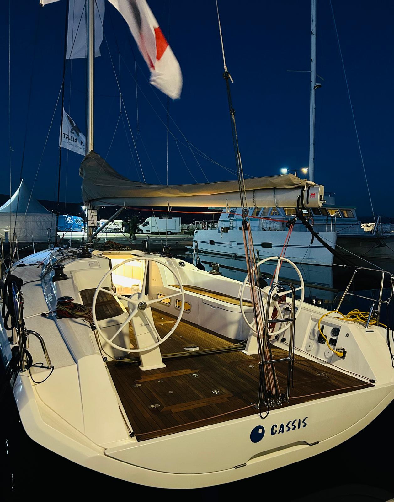 Italia Yachts IY 11.98 sailboat docked at night, 2023 model.