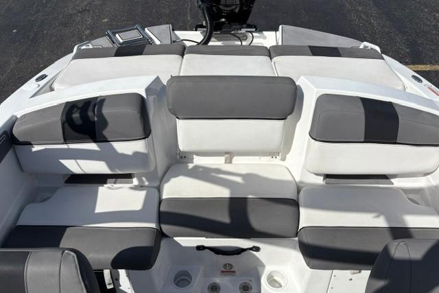 2024 Tahoe T21 boat interior with gray and white cushioned seating arrangement.