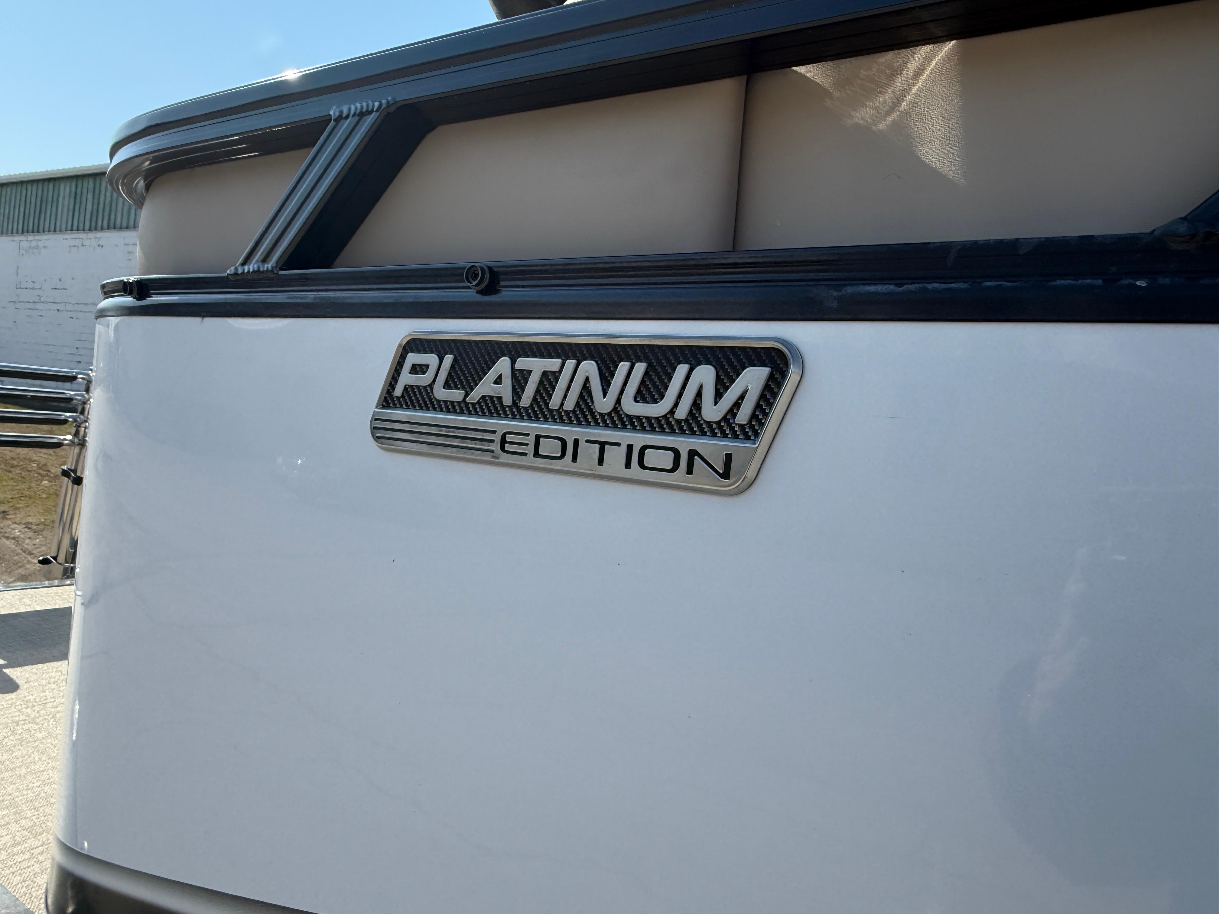 2025 Tahoe Pontoon LTZ Quad Lounger, Platinum Edition badge on sleek white exterior.