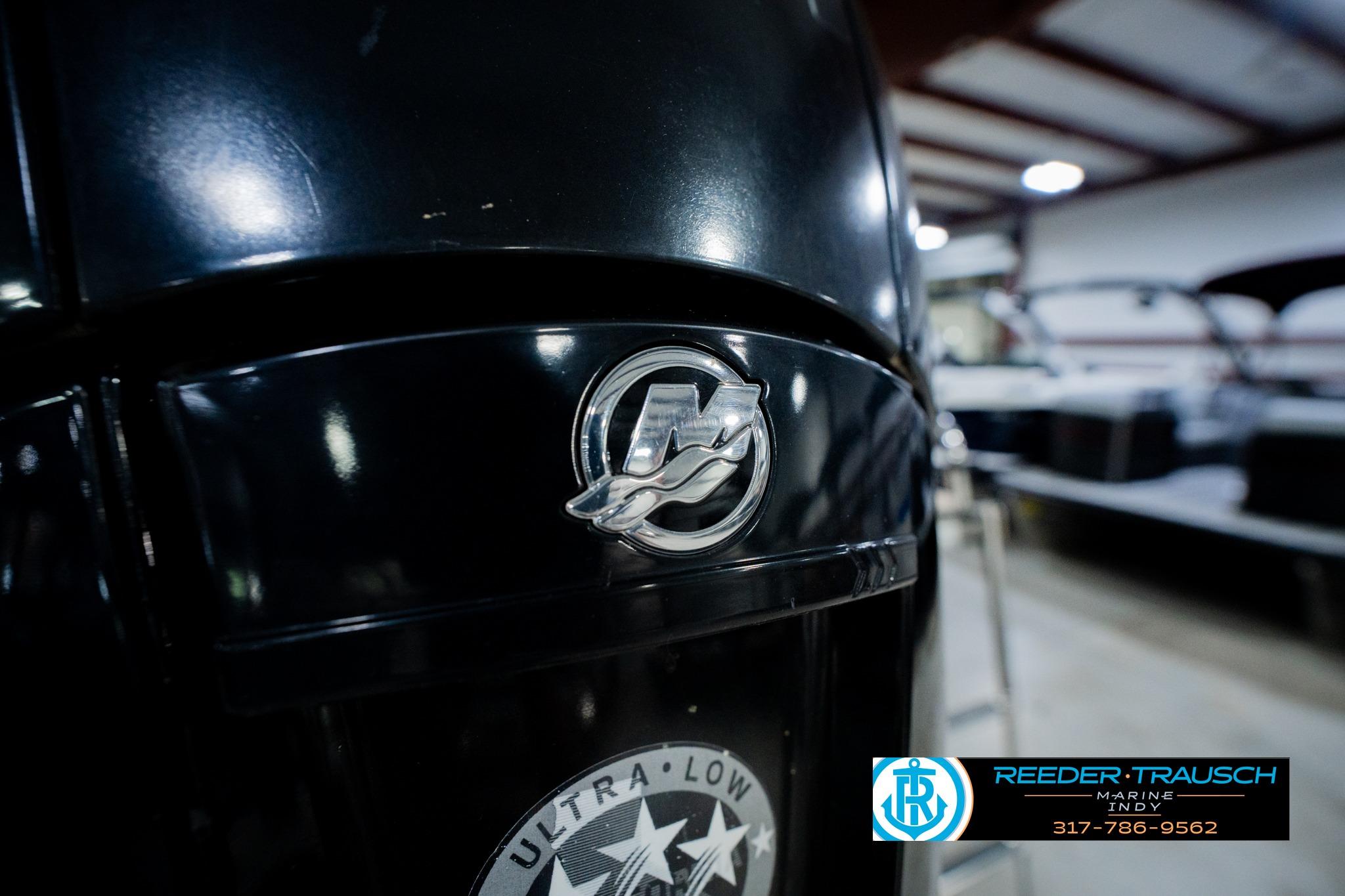 Close-up of a 2016 Crest 250 SLR 2 boat engine with logo in a showroom.