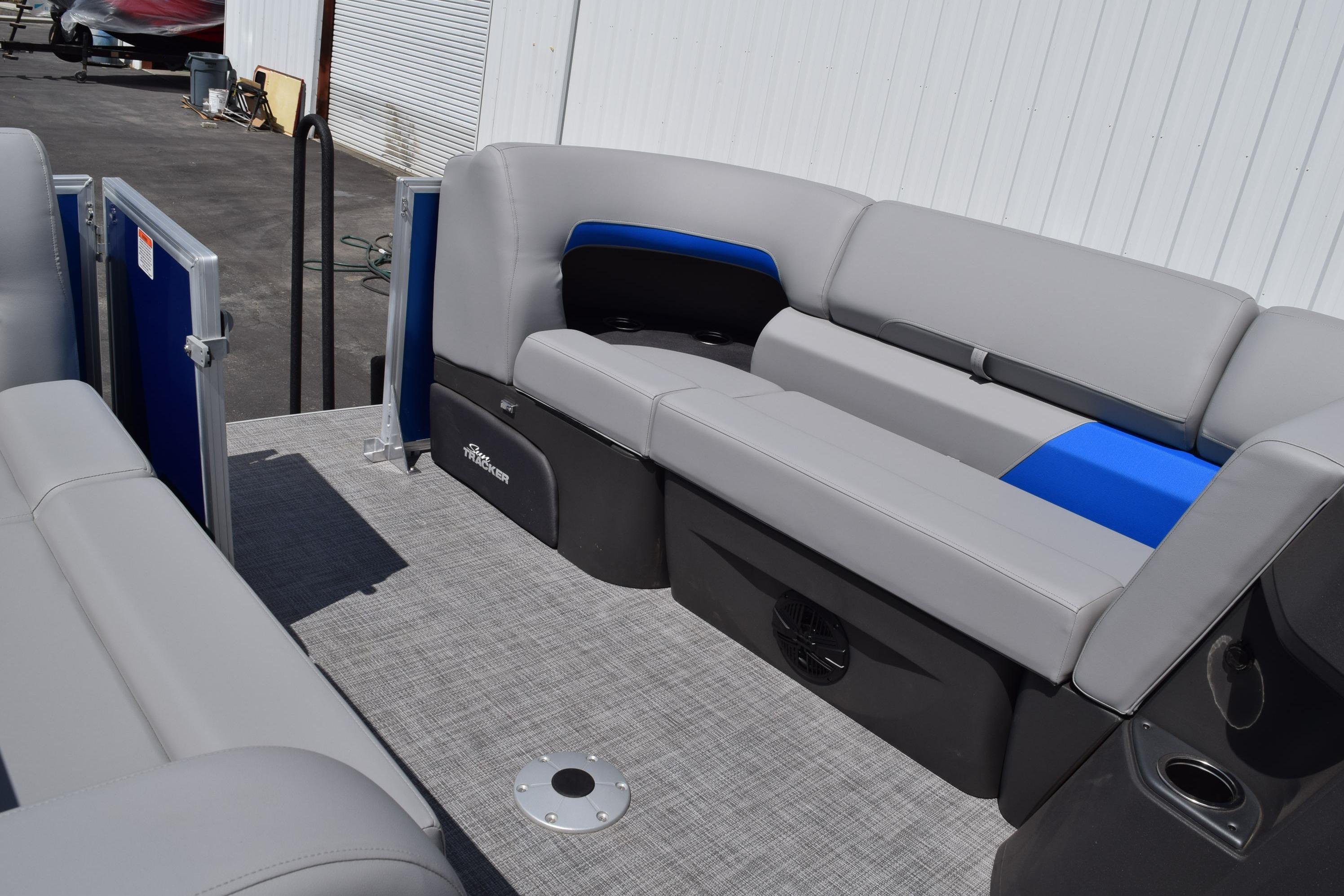 2026 Sun Tracker Party Barge 22 RF XP3 interior with gray and blue seating.