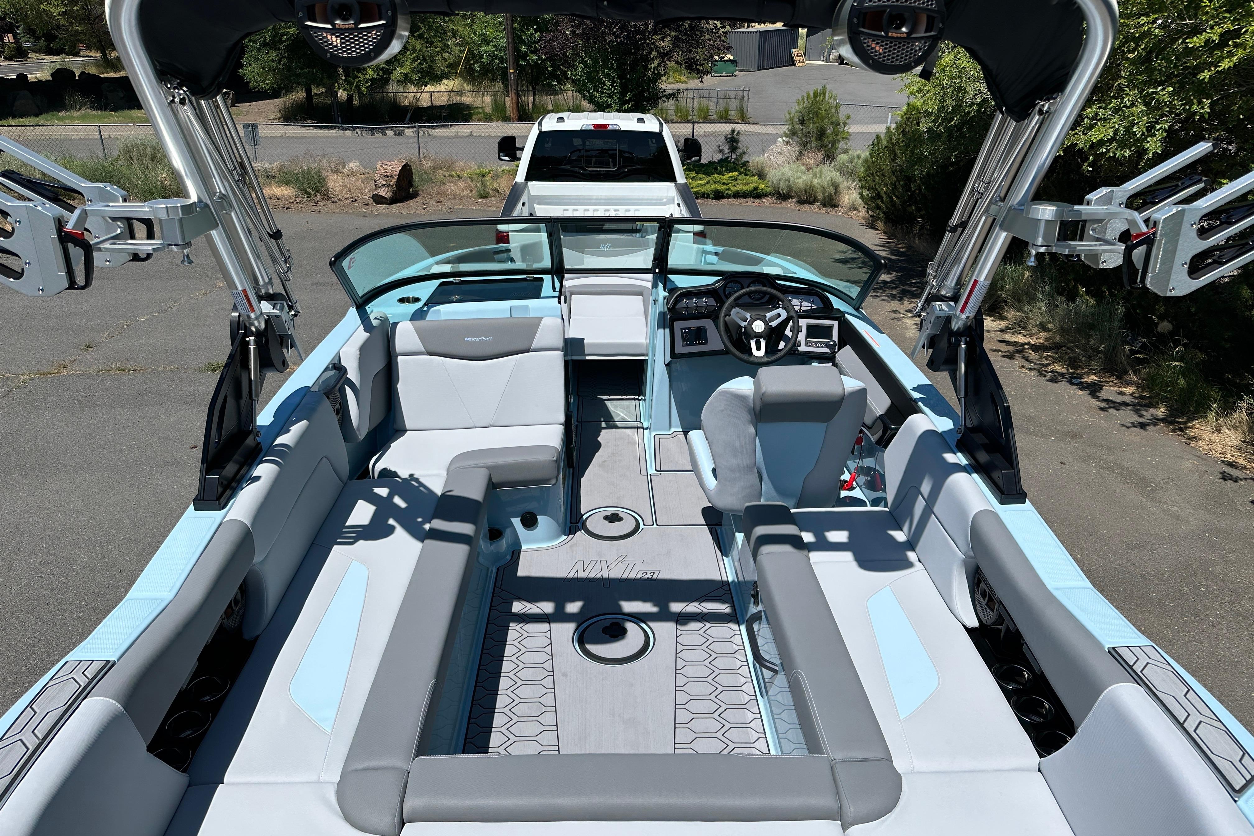 2023 MasterCraft NXT23 boat interior with sleek seating and modern dashboard design.