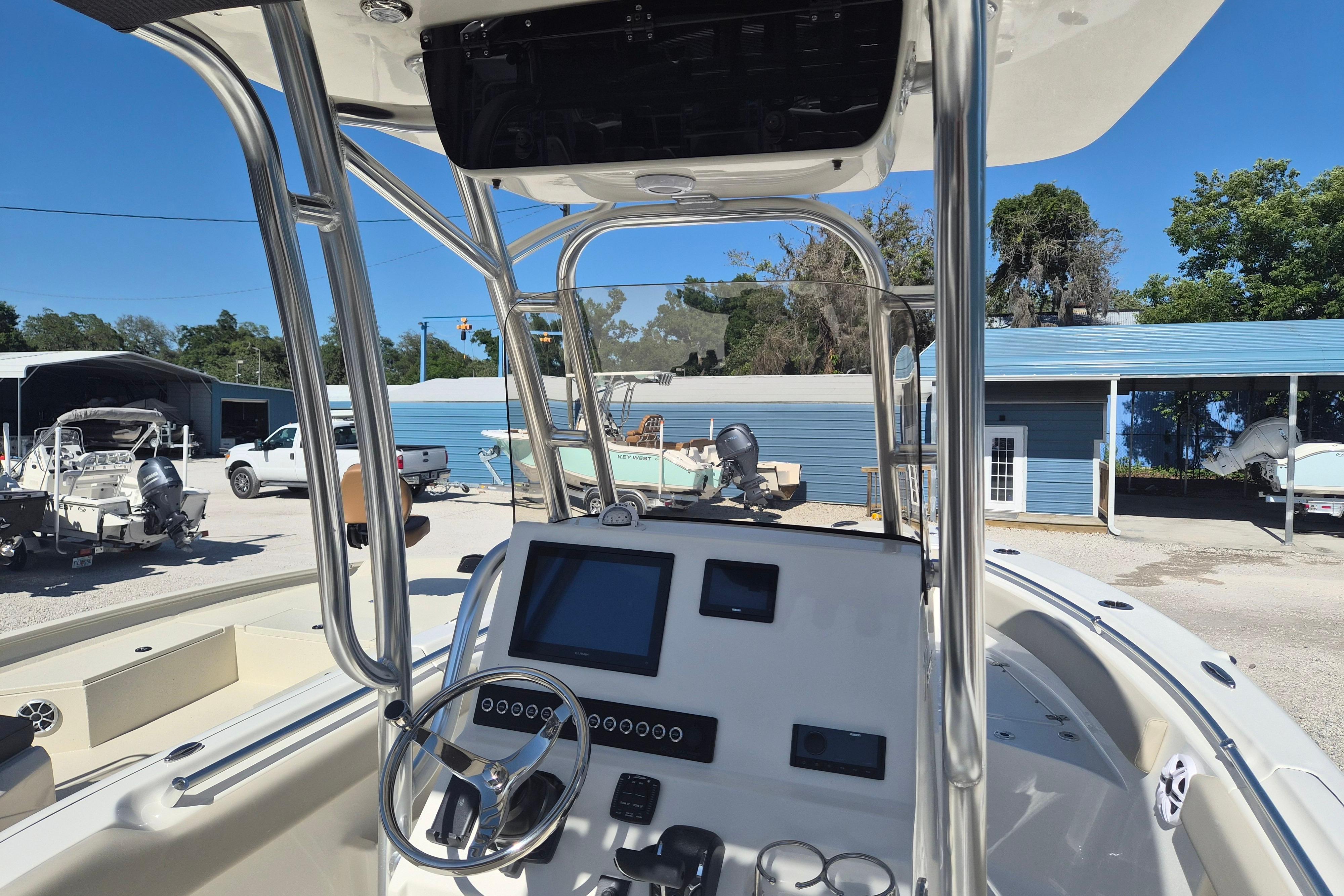 2026 Key West 239 FS boat interior with modern dashboard and steering wheel.