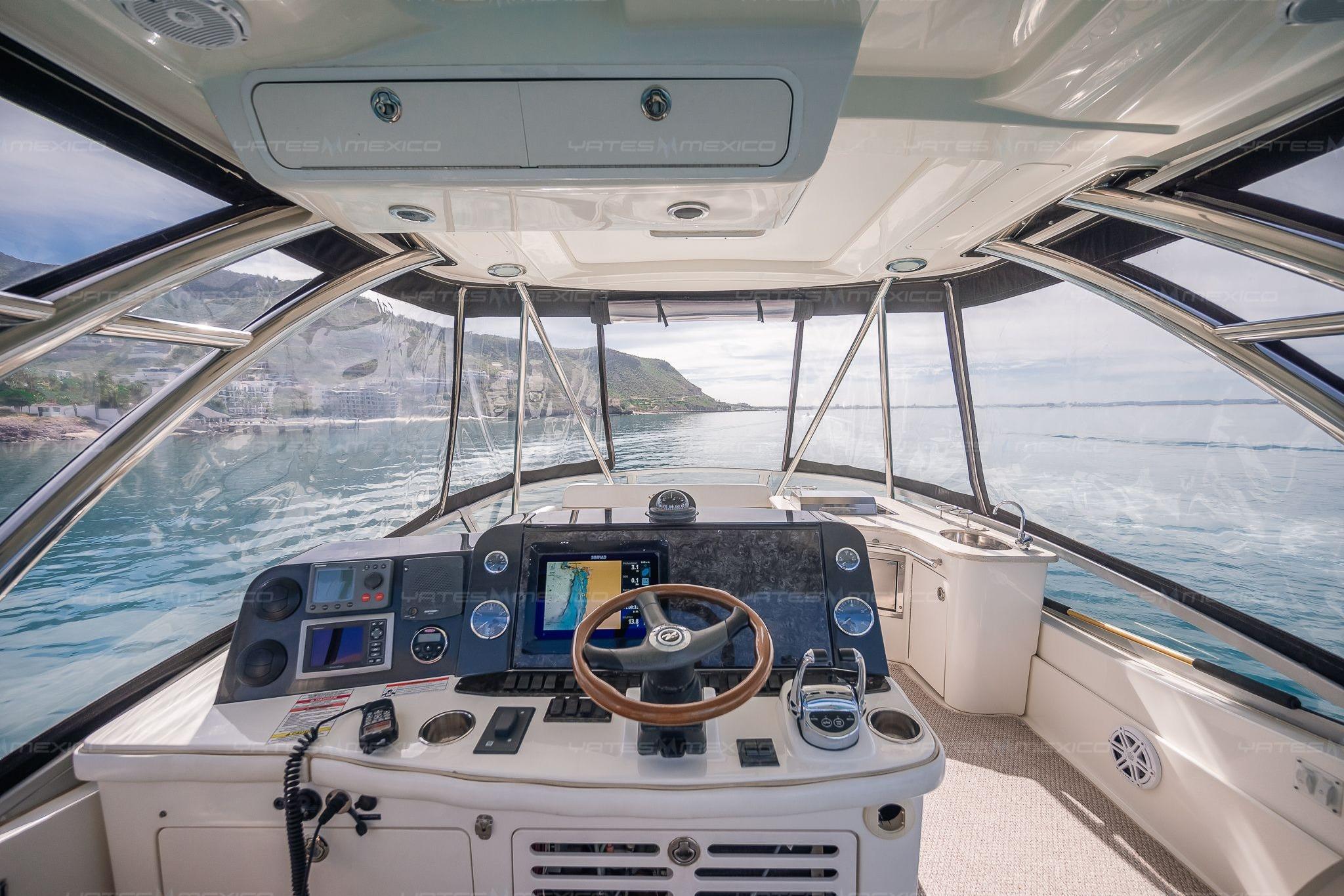Interior view of 2008 Sea Ray 480 Sedan Bridge yacht cockpit with navigation equipment.